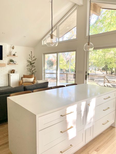 Kitchen island glass globe pendant lights

Gold hardware
Gold knobs and pulls
Gold handles
White cabinets
Kitchen renovation 
Open concept
Living room
Leather side chair
Armchair 
Sectional sofa couch
Chalet
Mid-century modern
Fireplace mantle 
Lighting

#LTKunder100 #LTKunder50 #LTKhome