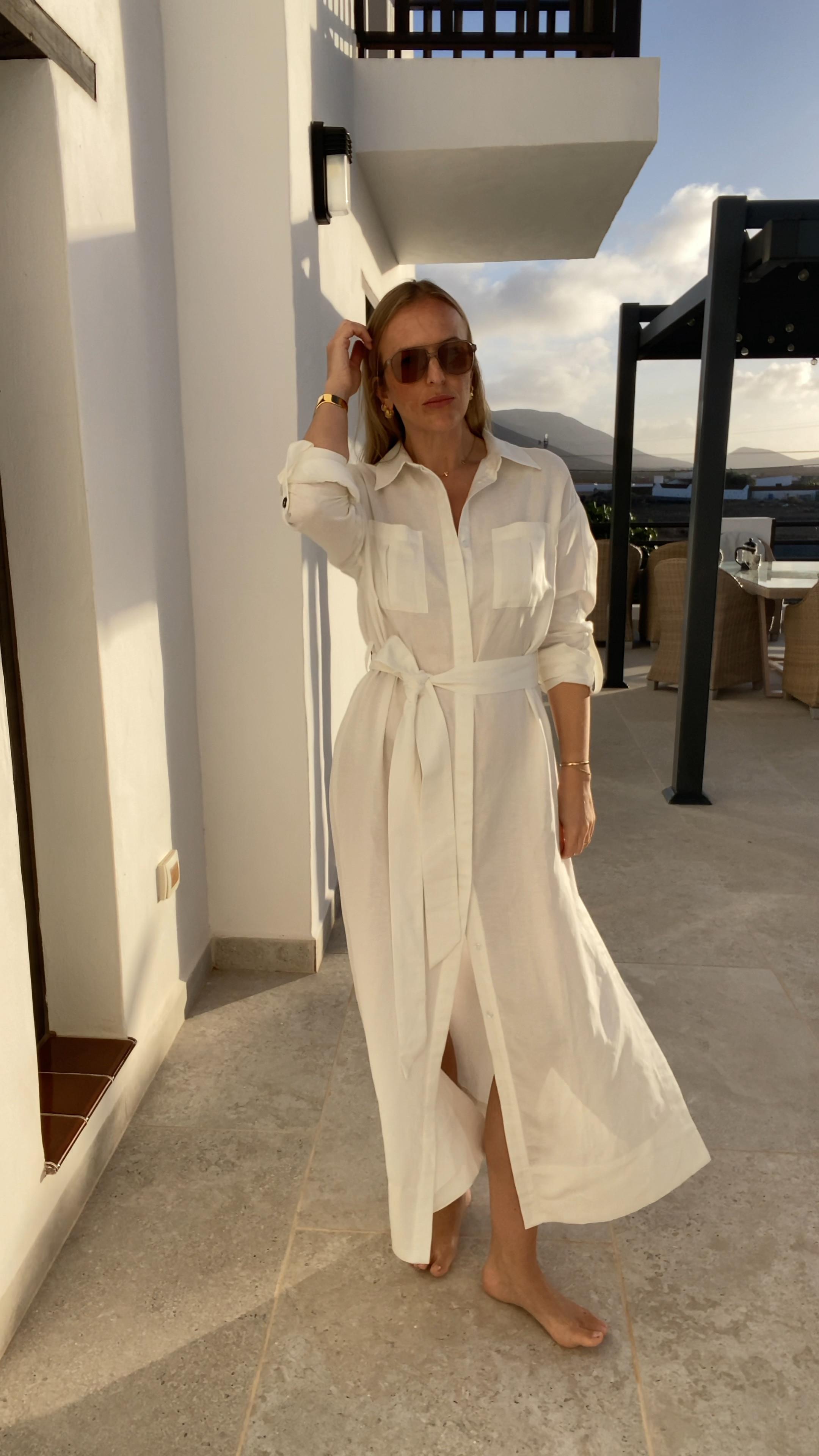 I’m always recommending shirt dresses as they are so easy to wear and suit most people. They dress up and down with ease , looking both effortless and timeless. This one is beautiful - a lovely longer line with deep side splits which add movement to the hem - you can add even more by unbuttoning the front as I have here. The fabric is a linen viscose which hangs well and feels premium and the finish very good for a high street piece. It’s sold with a cotton slip lining which works well if you’d like the dress for a more elevated summer occasion. I’ve left the slip out here and find the fabric thick enough with nude underwear. 
Wearing a U.K. 14 which I’d say is true to size. 

A stylish hard working piece 👌🏻 

Use code CLARE15 for an extra 15% off the sale price. 

Karen millen holiday outfit , white dress , occasion dress , linen dress 