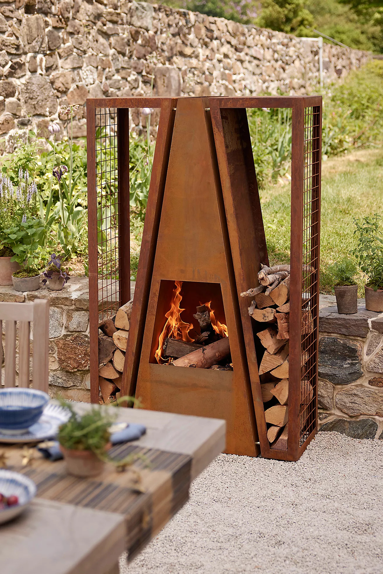 Weathering Steel Outdoor Fireplace with Log Holders | Anthropologie (US)