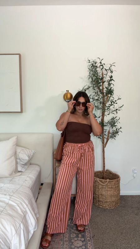 Amazon summer fashion for midsize girlies who prefer flowy pants over shorts. 

Pants L (but need a M, they stretch out a ton) 
Top M/L
Sandals TTS

Free people inspired, Amazon fashion, midsize, size 10. 

#LTKMidsize #LTKStyleTip #LTKFindsUnder100