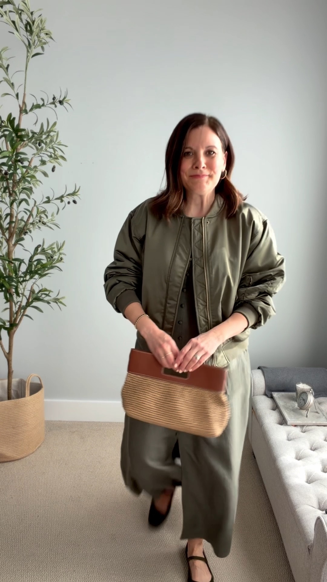 Birthday dinner outfit! The erratic spring temps were fluctuating by 25 degrees from day to day, and this was a cool day (lucky to hit 60 degrees), but I still wanted to wear my spring dress with short sleeves. I chose Mary Janes over open-toed sandals and threw on this jacket for an edgy look. I was actually a little warm in the restaurant and just kept the coat around me, and was perfect. Size down in this LOFT dress (gifted), I’m in a 4, it fits big and has a side zipper. It’s very forgiving in the midsection. I’m in a small in this bomber jacket, it fits big. Similar Mary Janes and bags are linked. 

#springoutfits2026 #springdresses #summeroutfits

#LTKSaleAlert #LTKMidsize #LTKOver40