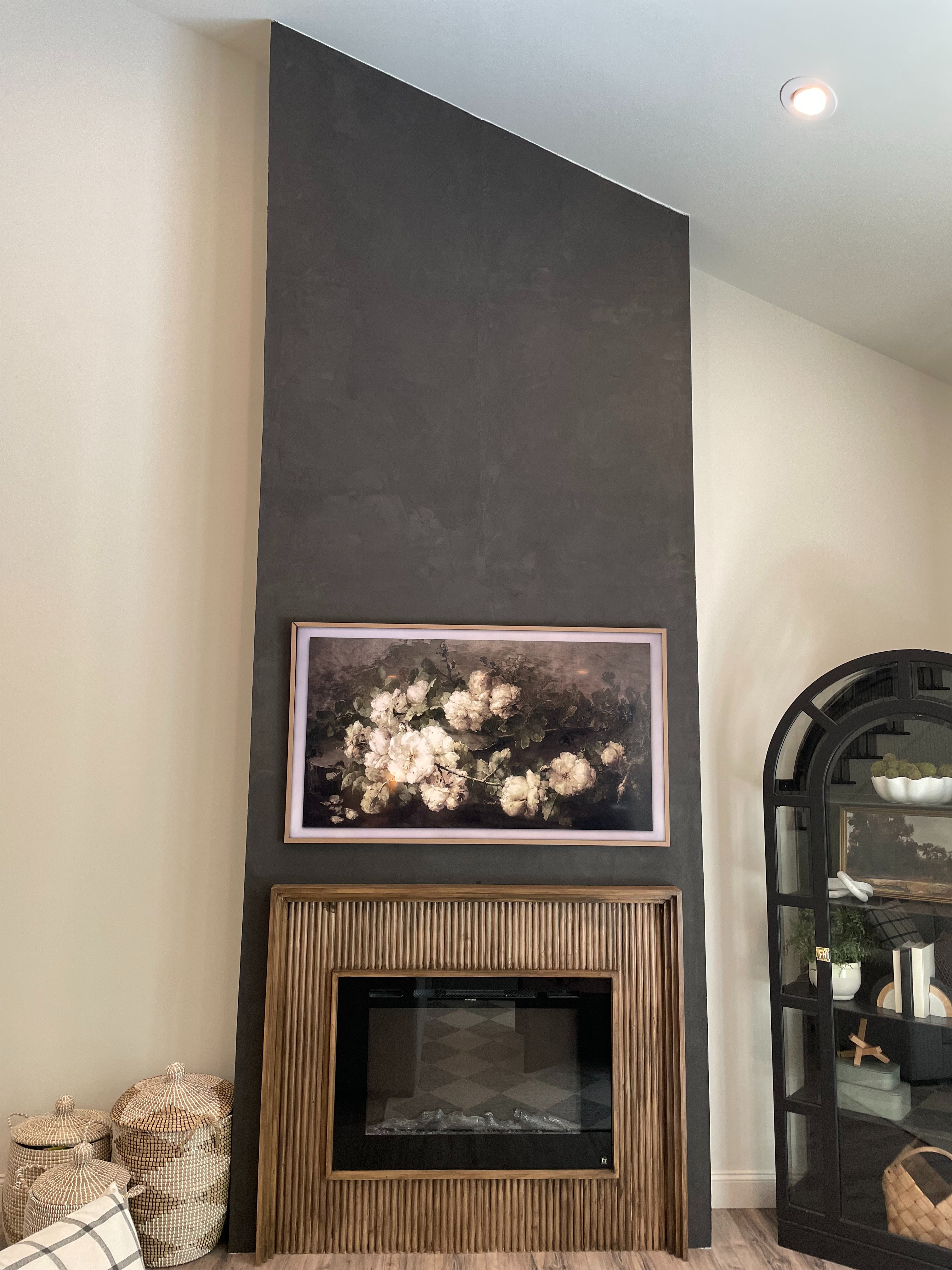 ✨ Transform your space! ✨ I turned a huge, blank wall in our living room with fireplace into a stunning DIY statement piece. From framing to drywall to a textured Roman Clay finish, this step-by-step project made our two-story living room feel warm, cozy, and totally elevated. Perfect for anyone dreaming of a modern fireplace that’s both functional and gorgeous. 🔥🖤 

 #LTKHome