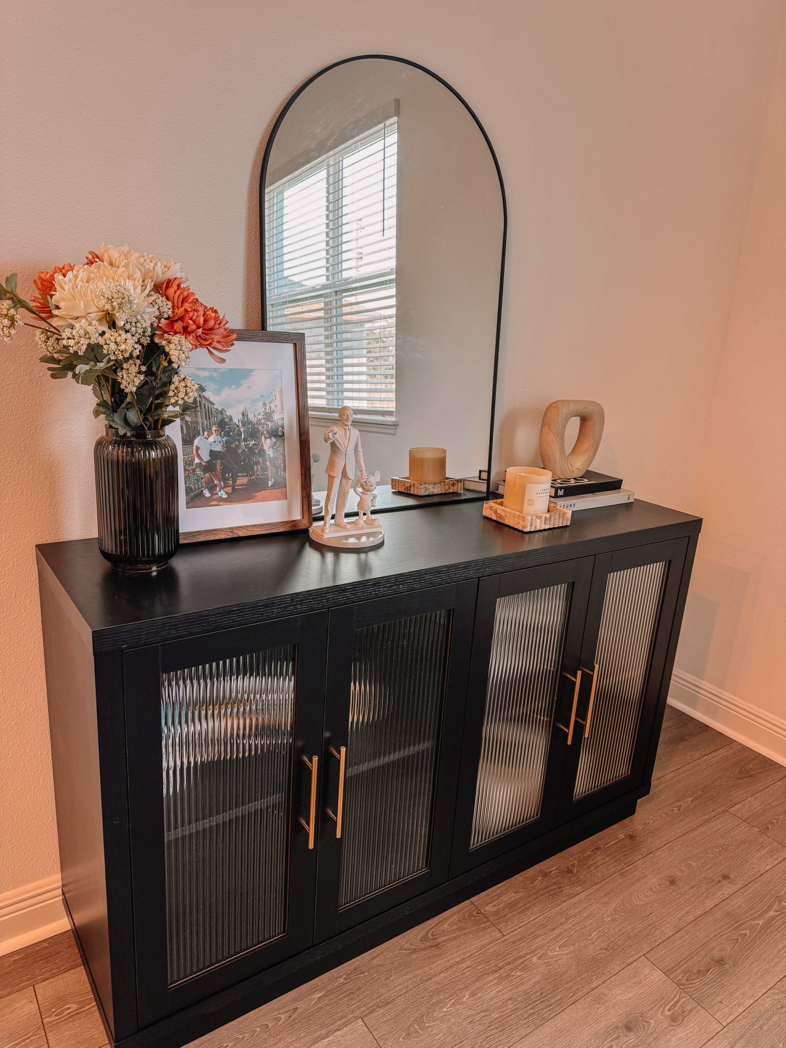 New sideboard just dropped in the kitchen/dining area and I’m obsessed! This Wayfair find is perfect for hiding my ever growing collection of seasonal mugs (yes, I do need a cup for every holiday).

Fun fact: I fully decorated this space around my Partners statue like it’s the main character (Walt & Mickey)… because apparently, it is. I just live here.

#WayfairFinds #KitchenDecor #DiningRoomStyle #LTKHome #SideboardGoals #InteriorInspo #MugCollector #SeasonalDecor #HomeVibes #LTKFinds

#LTKHome