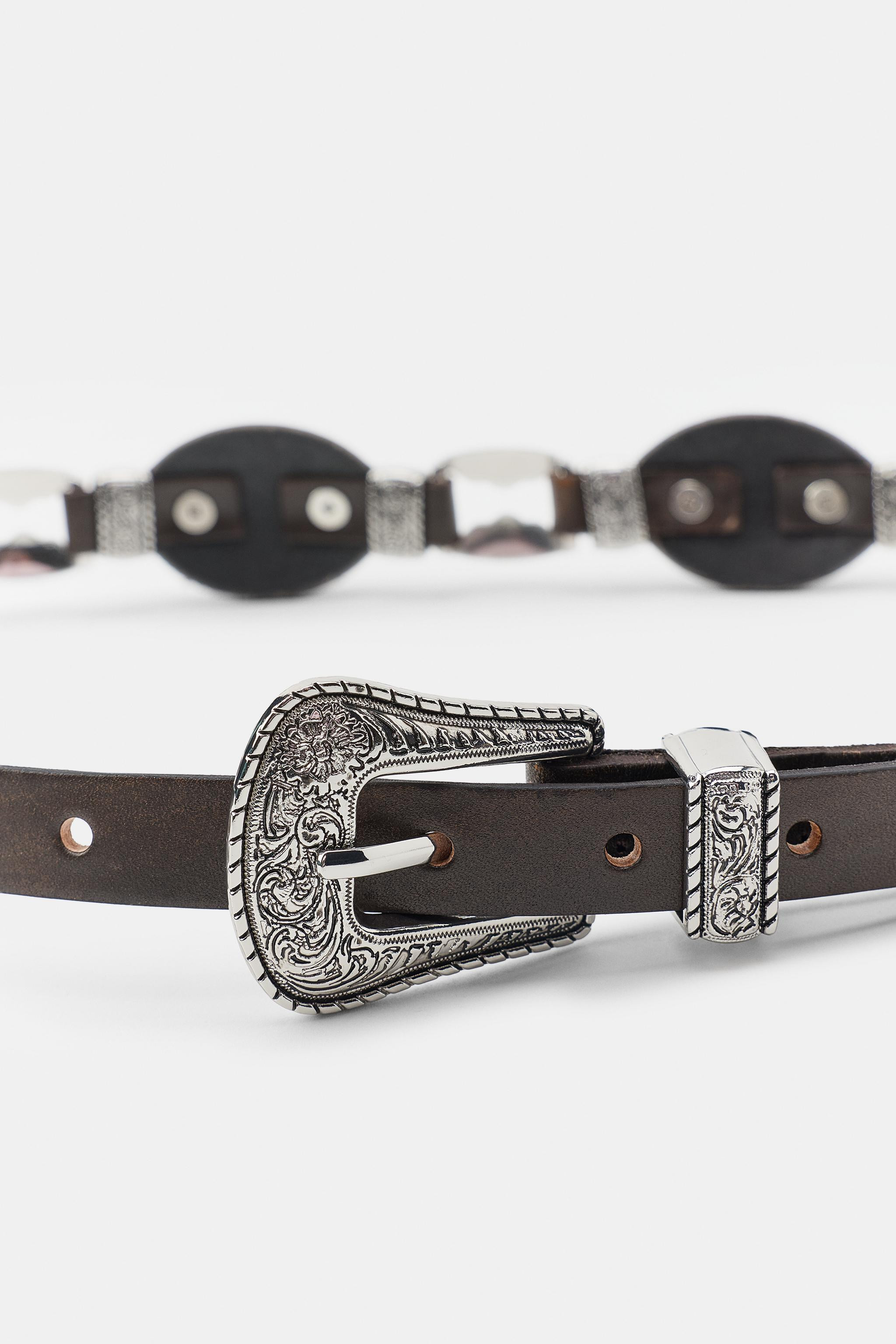 Contrast belt crafted from 100% leather. Featuring contrasting metal plate appliqu\u00e9s and an ... | Zara IT