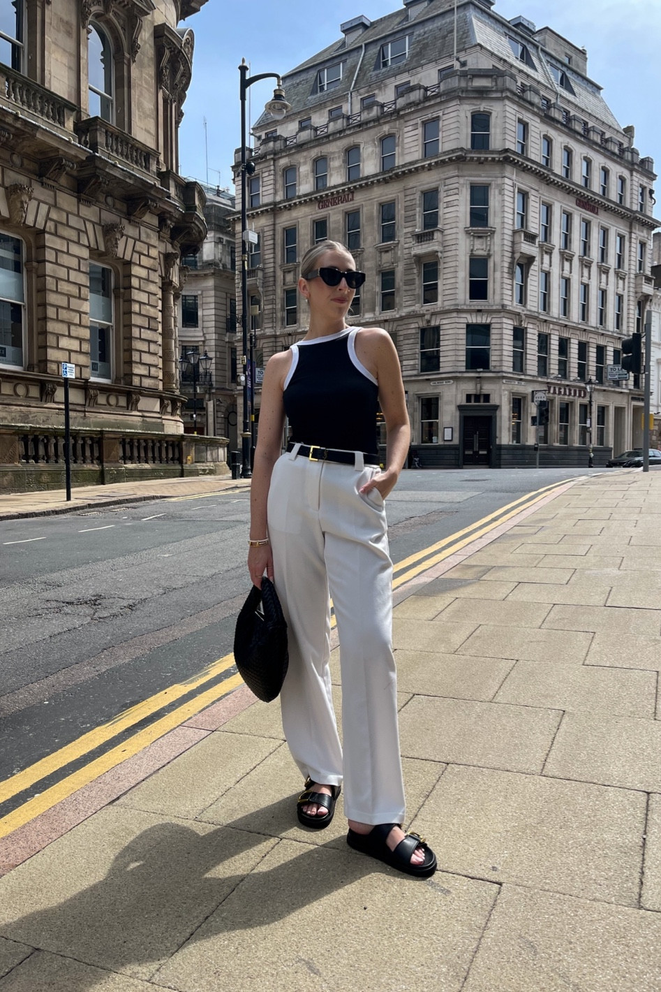 Monochrome outfit for summer in the city ☀️

Black and white vest, white trousers, monochrome, black sandals, black bag, chic outfits 

#LTKunder100 #LTKstyletip #LTKFind