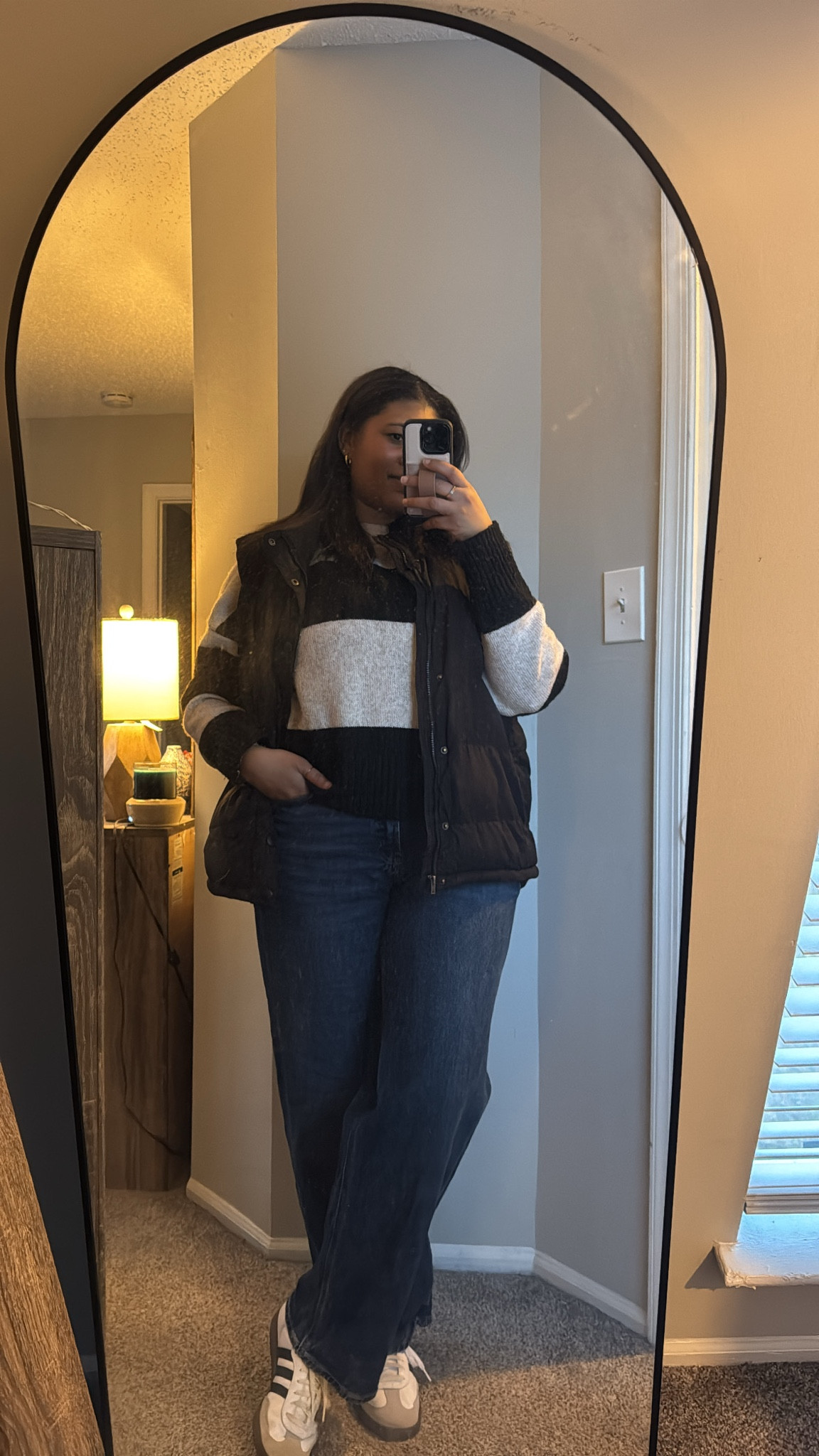 Casual Friday vibes! 🖤✨ Staying comfy yet polished with a cozy color-block sweater, a classic black puffer vest, and wide-leg denim for an effortlessly chic look. Finished it off with Adidas sneakers for a sporty touch—perfect for tackling the workday and rolling into the weekend.

Find similar styles linked on my LTK—shop the look now!

#LTKWorkWear #CasualFridayStyle #OOTD

#LTKStyleTip #LTKShoeCrush #LTKWorkwear