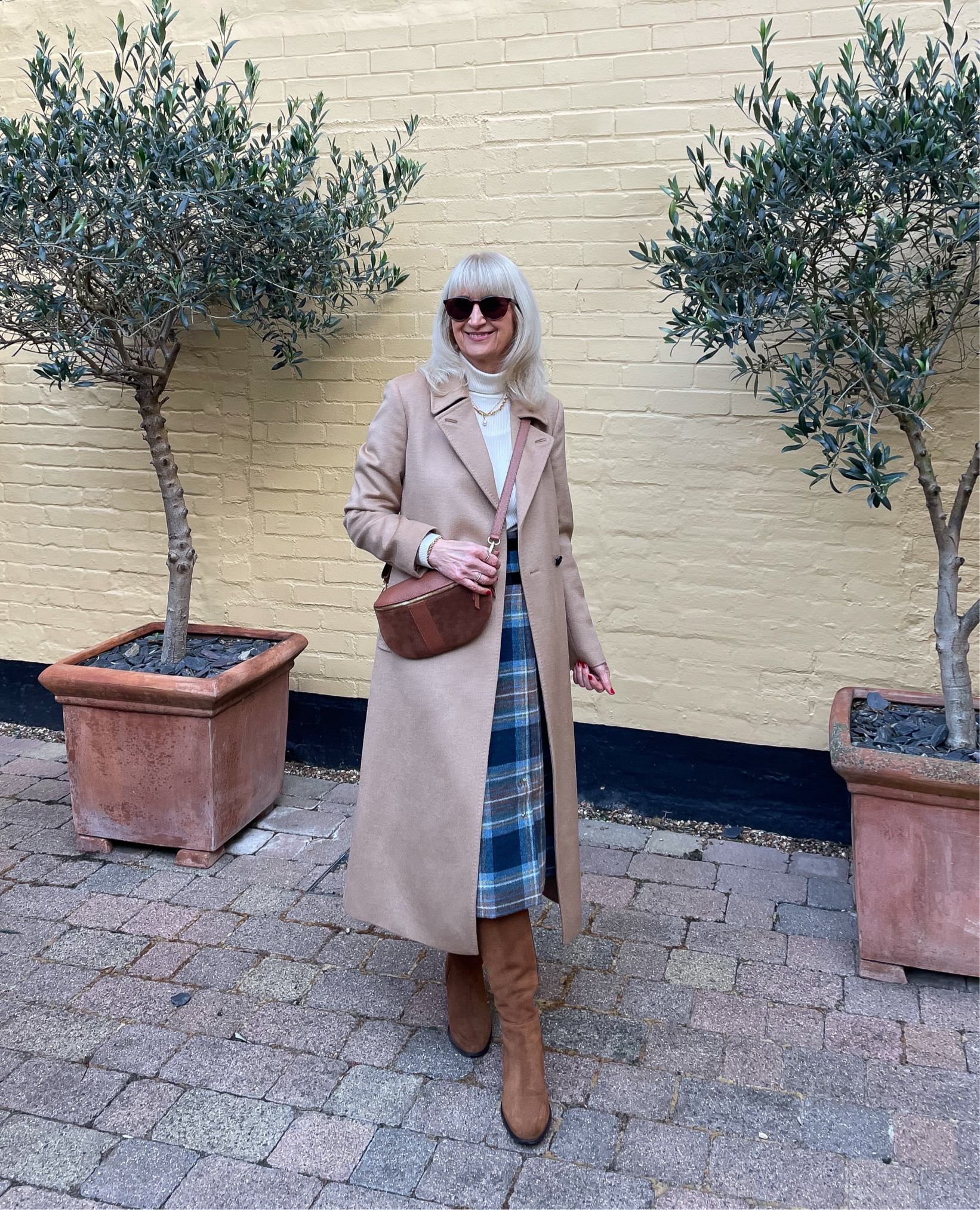 Winter coat 
Neutral wool wrap coat midi length with tan boots and bag. Tartan skirt and cream polo neck. 


#LTKwinter #LTKuk #LTKeurope