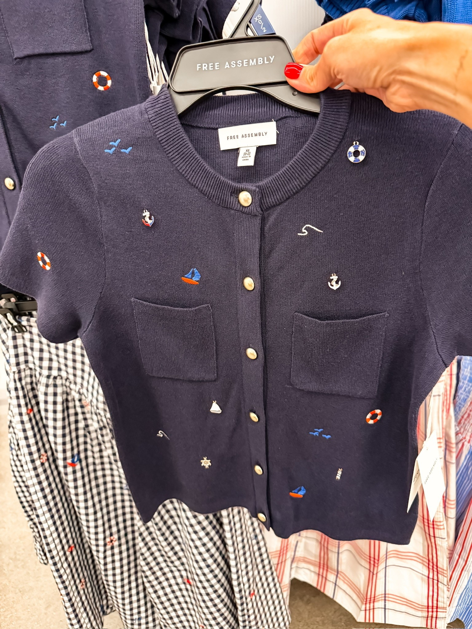 This little nautical cardigan is giving coastal summer in the best way. The tiny embroidered sailboats and anchors make it look so much more expensive, and I love that you can wear it buttoned up as a top or layered over a tank for cooler nights. Such a cute Free Assembly find for summer vacations, beach trips, and patriotic weekends.

coastal style, nautical outfit, summer cardigan, Free Assembly finds, beach vacation outfit, navy cardigan, coastal grandmother style, sailor inspired fashion, affordable summer fashion, Walmart fashion find, patriotic summer outfit, preppy summer style, themominstyle

#LTKSeasonal #LTKTravel #LTKOver40