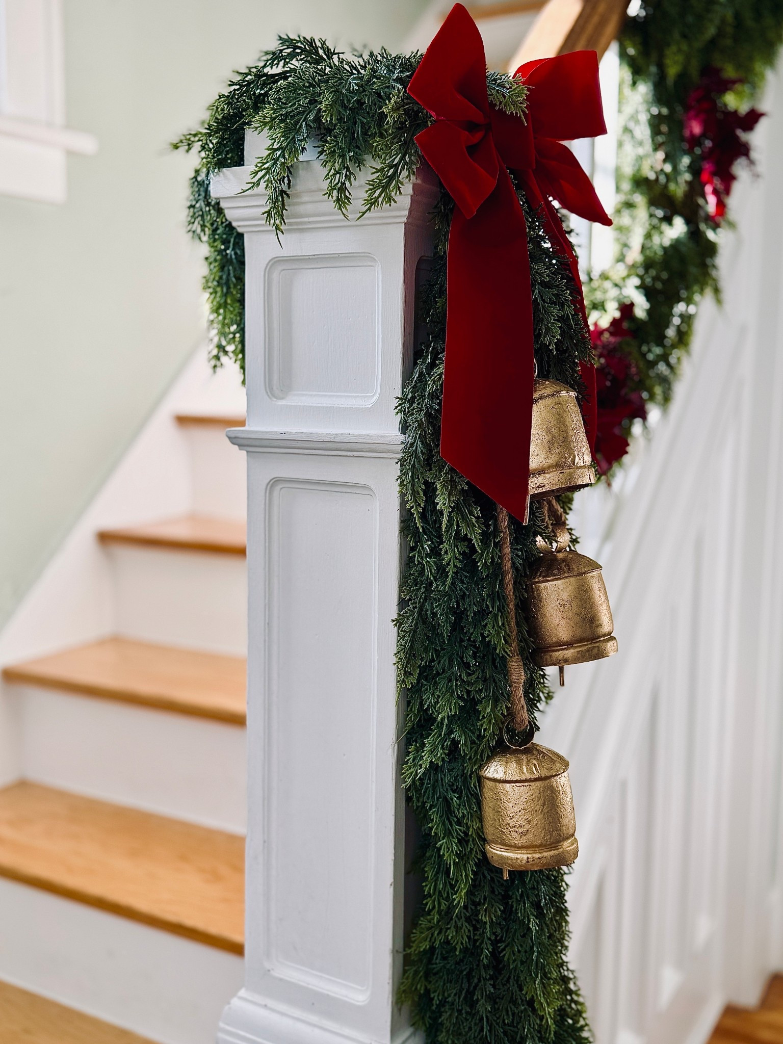 Holiday touches coming to life!🎄
✨Loving this timeless little moment on the staircase. 

Garland and bells are from Hobby Lobby but I linked nice quality alternatives that are currently on sale! 

#LTKCyberWeek #LTKSeasonal #LTKHoliday