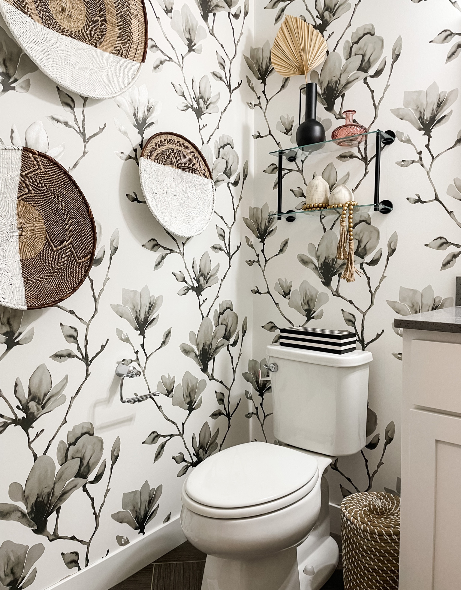A Powder Room is one of my favorite places to go bold, as it’s one of the most used spaces, and often shared with guests. 🖤 

Here we added a dressed up, statement wallpaper and layered it with natural textures of Earth for a bespoke vibe that’s both warm and beautiful. 🪷

#LTKhome #LTKfamily