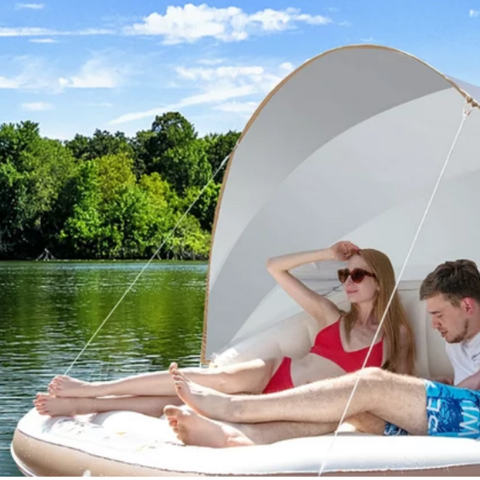 Costway Floating Island Inflatable Swimming Pool Float Lounge Raft with Canopy SPF50+ Retractable Detachable Sunshade with Two Cup Holders White
Now $109.99
was $129.99
(4.5)
4.5 stars out of 33 reviews
33 reviews
Price when purchased online

Best seller Popular pick

Enjoy a cool and fun summer day on our pool float with canopy! The canopy is crafted of 190T silver-coated fabric with UPF50+ to protect you from harmful rays. In addition, you can adjust the canopy to get comfortable shade without dazzling bright sunlight or remove the canopy to be used as an outdoor inflatable lounge chair. The combination of the spacious seat, ergonomic backrests, and armrests provides you with a cozy user experience. Premium PVC material and sturdy segmented fiber tubes make sure it can accompany you for a long time. This canopy island only takes a few minutes to inflate and deflate, greatly saving your precious time. It will undoubtedly be a perfect complement to any outdoor activities, such as sunbath and pool parties, etc. 
Display Video： https://youtu.be/3TkA5e4Em_4 


Feature 
The spacious seat allows 2-3 adults to lie down with ease 
Canopy made of 190T silver-coated fabric with UPF50+ for sun protection 
Adjust the canopy to block off dazzling bright sunlight 
High-quality PVC material is durable, waterproof and wear-resistant 
Heavy-duty segmented fiber tubes account for reliable structure 
Ergonomic backrests and armrests for optimal comfort 
2 built-in cup holders facilitate the placement of beverages 
Used as an outdoor inflatable sofa when you remove the canopy 
3 Upgraded air valves for easy inflation and deflation in a few minutes 
After deflation, the compact pool float is easy to store and carry around 

#LTKtravel #LTKGiftGuide #LTKsalealert