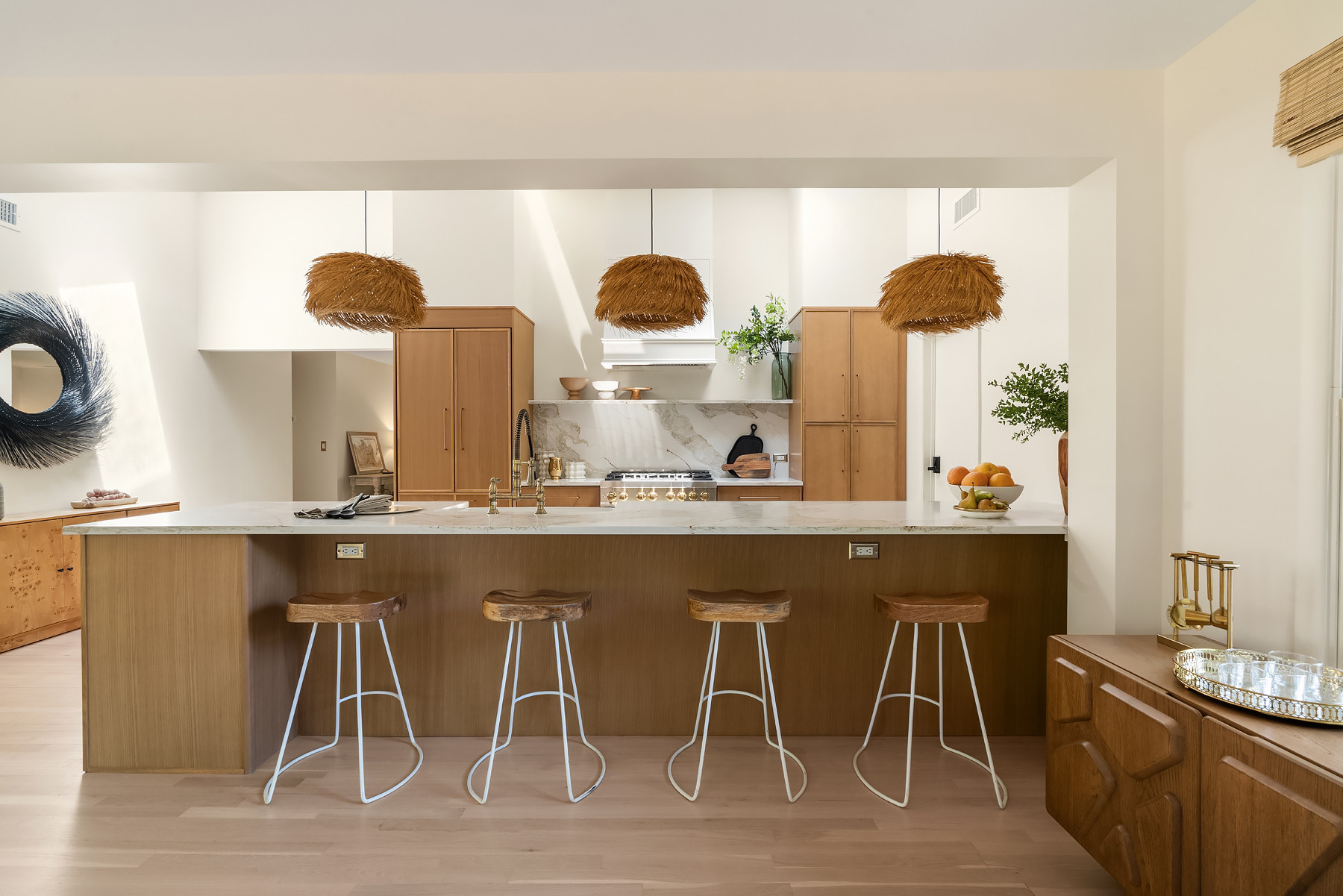 Oak cabinets, quartz with warm undertones and woven lighting layered throughout this kitchen — it keeps the space feeling grounded but still light.
Linked exact and similar pieces below. 

 #LTKHome #LTKSaleAlert