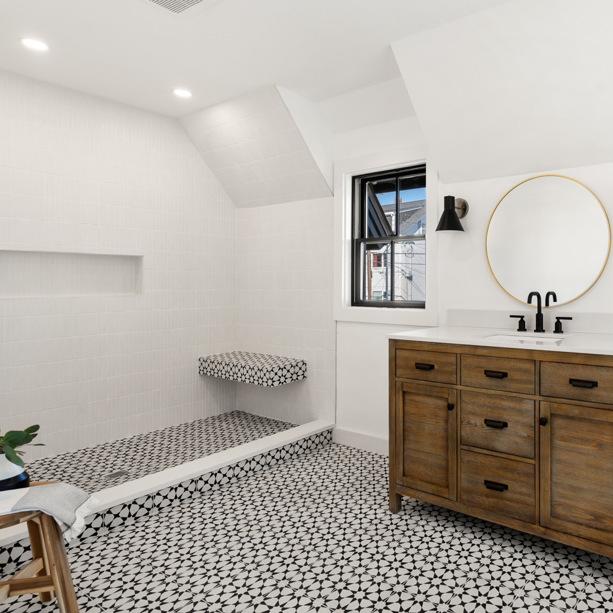 we went bold with the tile in the #witchymodernhouse bathroom, using a black and white star pattern cement tile for the floor and floating shower bench. since the star tile was so eye catching, we kept it simple with the wall tile, opting for a matte white kitkat tile stacked in a vertical grid pattern. #dwelloctober

#LTKhome