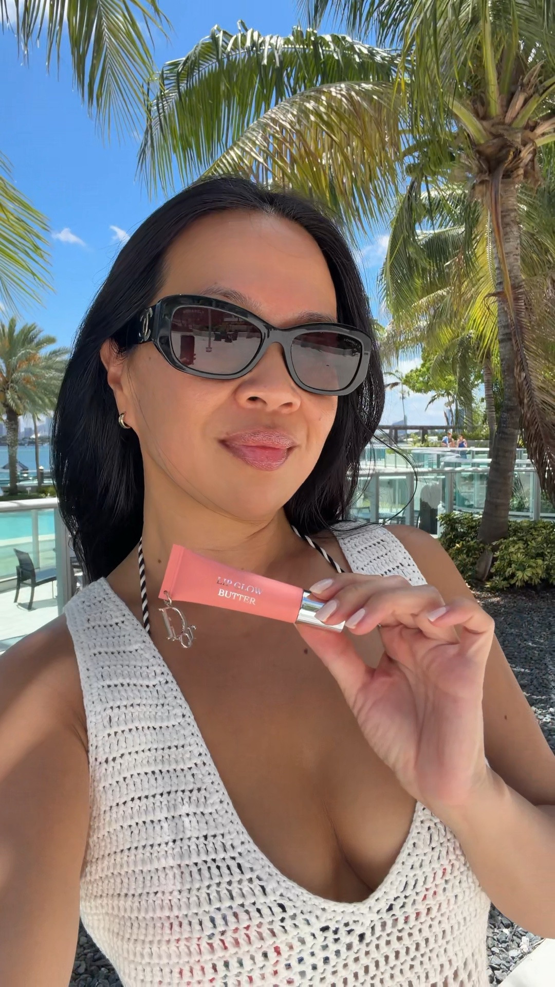 Beach beauty with Dior Pomelo and Sunscreen. Sunglasses Chanel. Crochet beach dress coverup Superdown wearing an XS. Nail is OPI I’m a Beach Bunny

#LTKBeauty #LTKSwim