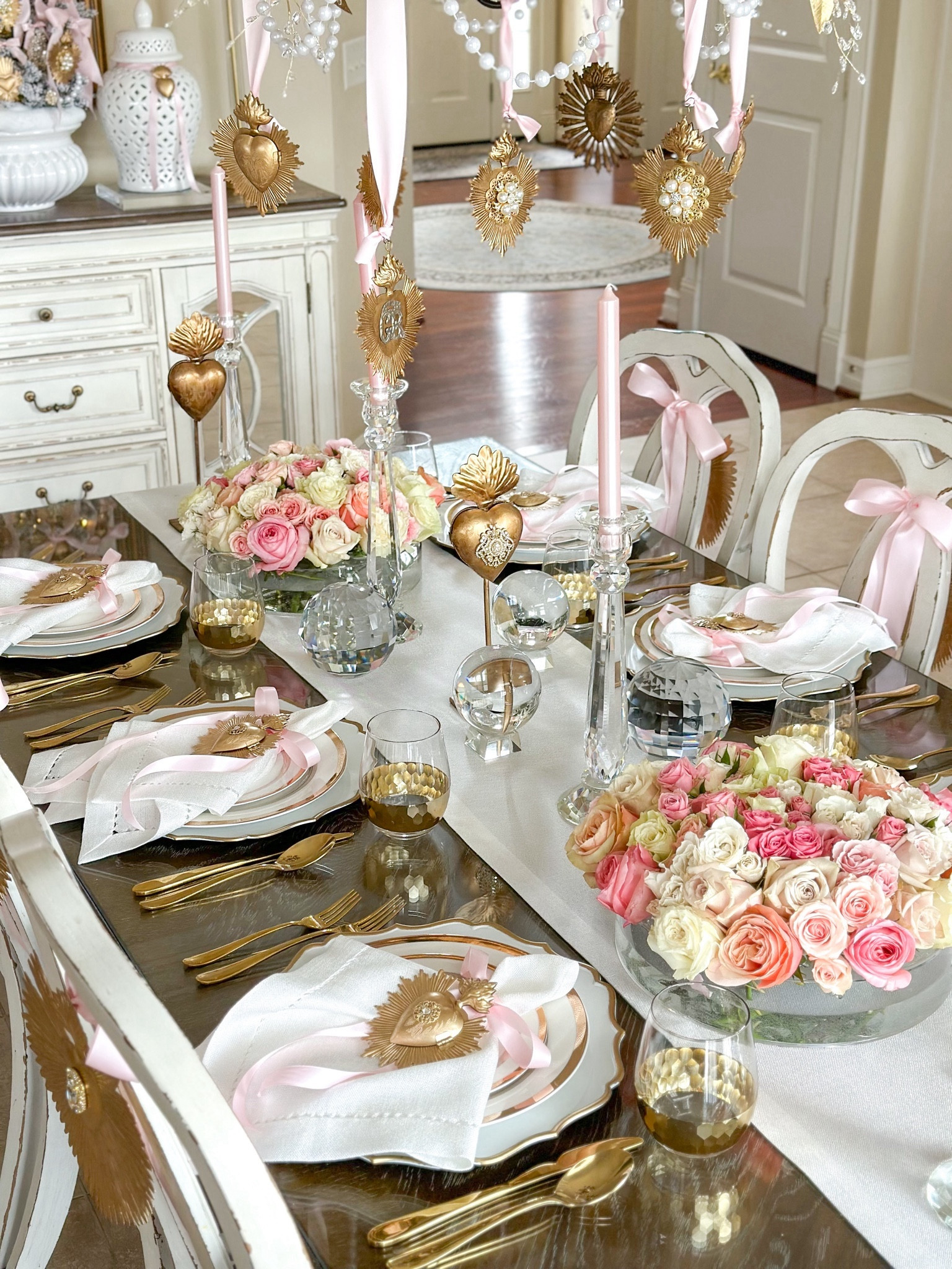 Shop my Valentine’s Day tablescape! 

Sacred hearts, Milagro hearts, acrylic vase, floral arrangements, Valentine’s Day flowers, valentines inspo, valentines decor, white linens, white napkins, table runner, gold hearts, gold flatware, pink bows, crystal candleholders, pink candles, pink decor, crystal orb, Amazon finds, Etsy, queen of crowns, gold wine glass, pink ribbonns

#LTKGiftGuide #LTKSeasonal #LTKhome