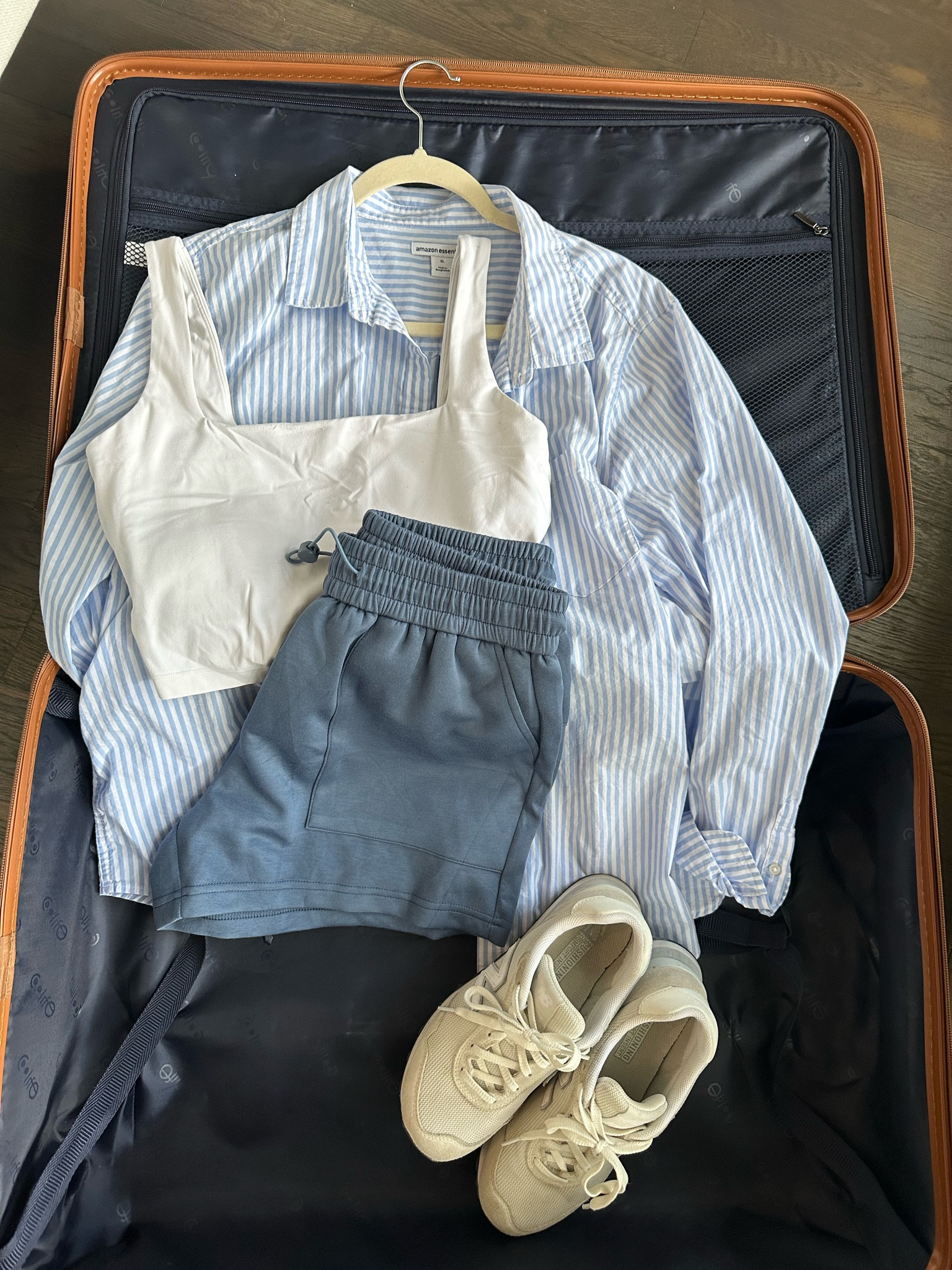 What I packed! Travel outfit: sports bra tank in S, lounge shorts in M, button up in XL for an oversized fit, sneakers tts.

#LTKTravel #LTKSeasonal #LTKStyleTip
