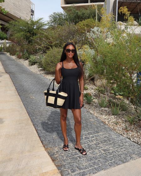 Outfit of the day for lunch in Cabo! Wearing a size 4 in this black tennis dress! Paired with Oran sandals and my straw DeMellier tote bag! 

#LTKtravel #LTKitbag #LTKshoecrush