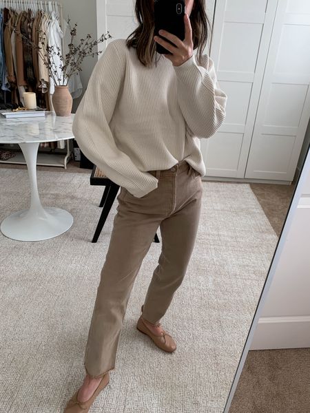 J.crew ribbed sweater. Runs big. Wearing the xs but need the xxs. 

Sweater - j.crew xs
Jeans - Gap petite 26. Sizes up 2 sizes. 
Flats - Mansur Gavriel 35