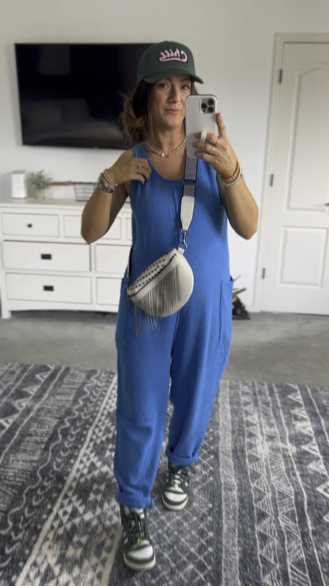 Loose knit jumpsuit styled casually! Super soft and stretchy, & perfectly oversized to accommodate a baby bump! 

#LTKbump #LTKVideo #LTKstyletip