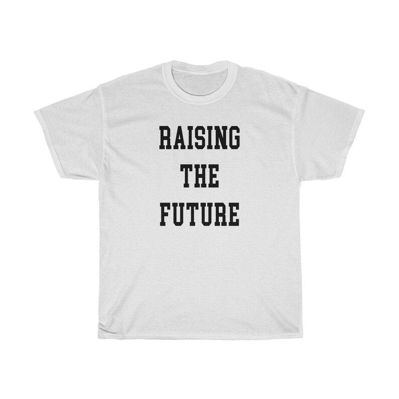 Read the full title
    Meghan Markle’s ‘Raising the Future’ T-SHIRT - UNISEX | Etsy (US)