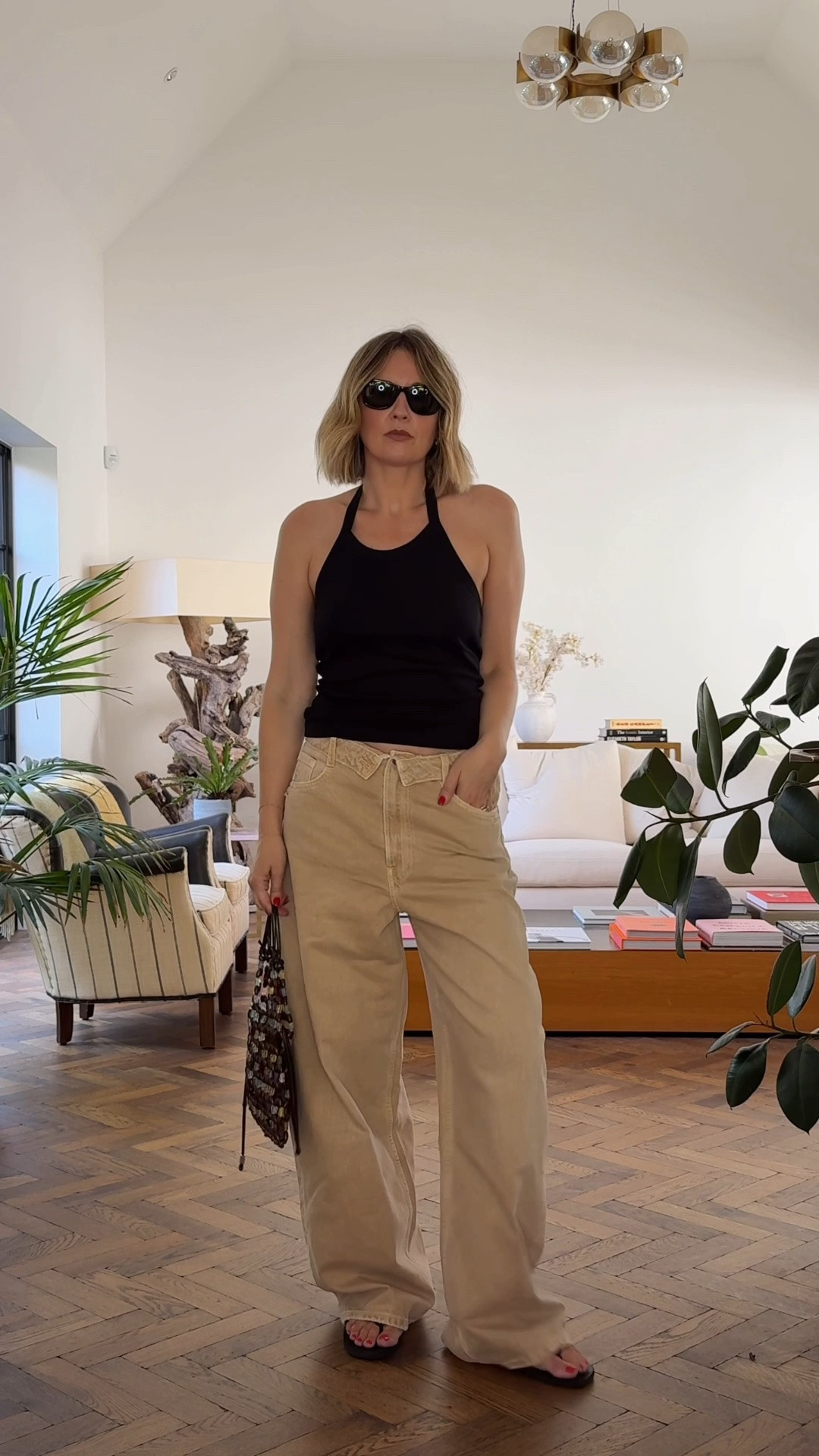 Beige jeans and a black halter-neck top | Summer uniform | Zara | Flore Flore | Flip flops | Staud Bag

#LTKsummer #LTKuk #LTKdatenight