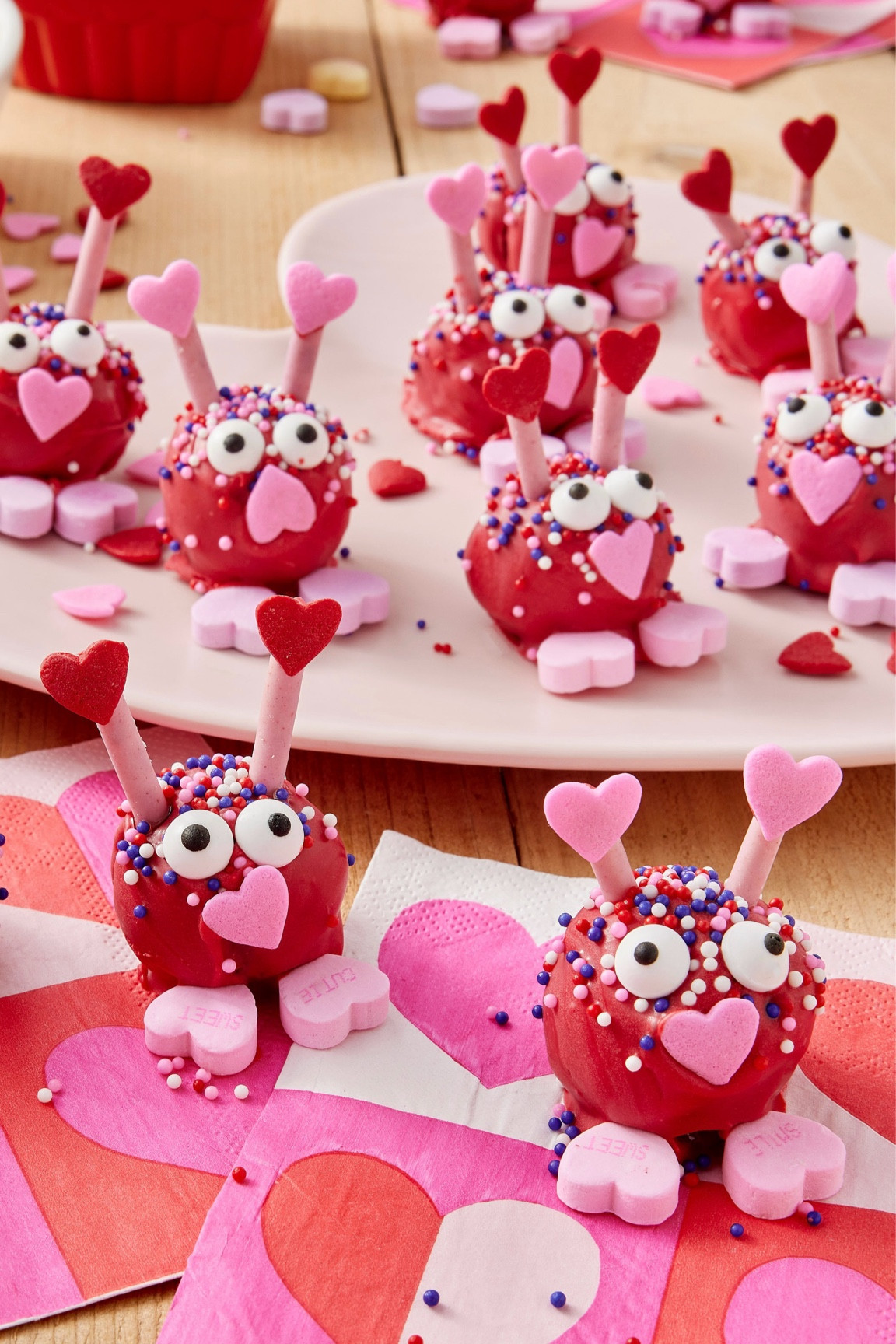 Love Bug Bites are perfect to make for classmates, friends, family, or your sweetheart on Valentine’s Day! Made with red velvet cake mix and a variety of festive sprinkles and candies, these edible crafts are sure to win over any heart! 🥰

#LTKSeasonal #LTKFamily #LTKParties