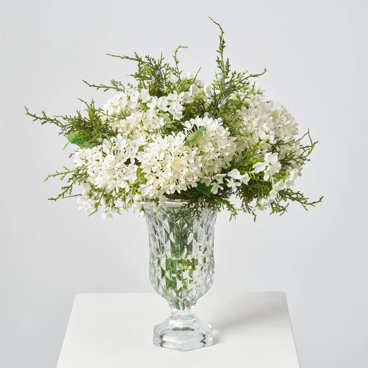 Lifelike White Snowball Blooms & Winter Juniper Berry Greenery in Crystal Footed Urn Holiday Cent... | Darby Creek Trading
