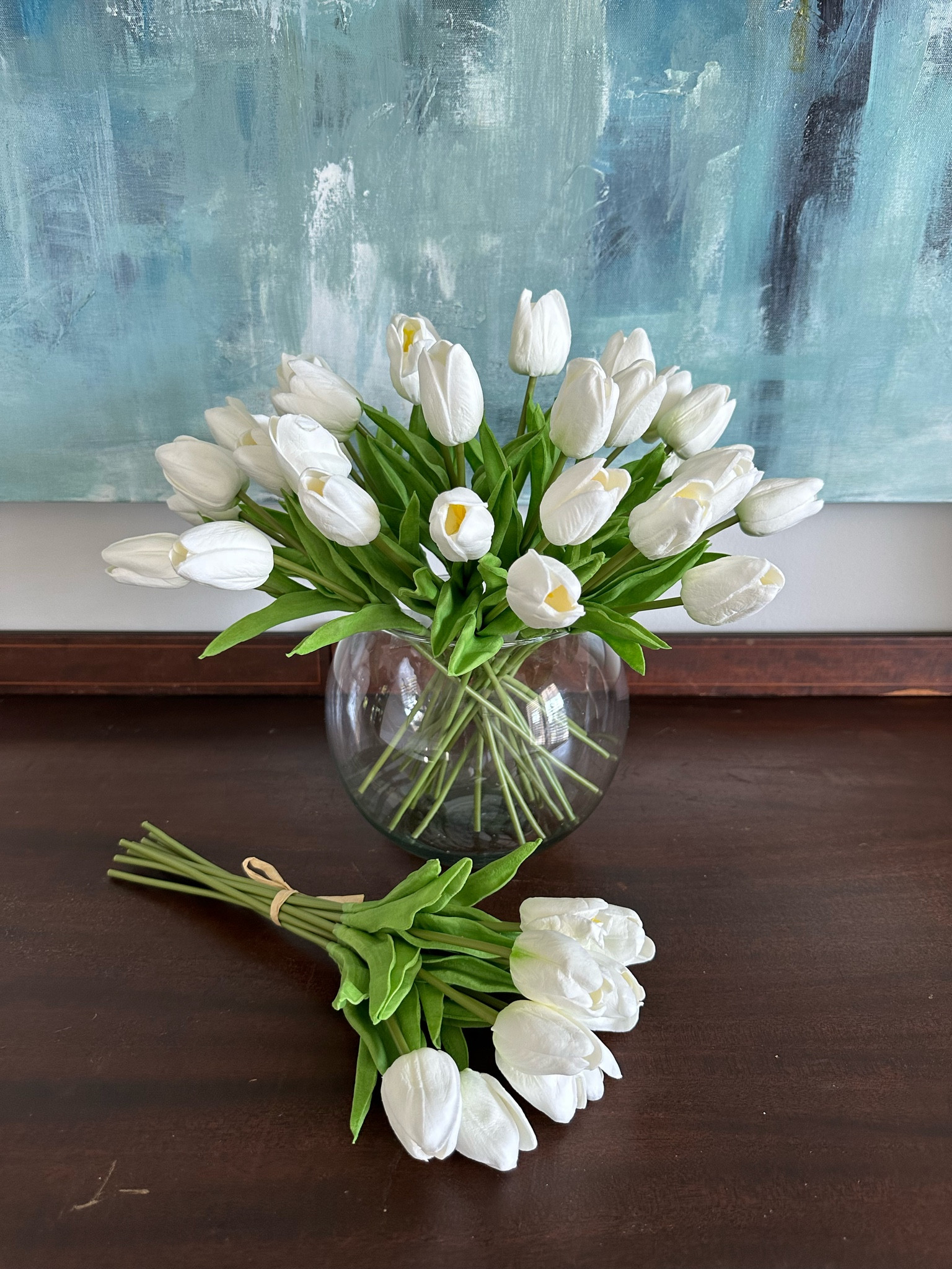 I love these Faux tulips from Amazon! I have them in our dining room and they look so real! I have 1.5 packs in this vase and used the other bundle on our kitchen island. I used 4 strips of tape to support the stems in the glass vase 

#LTKhome