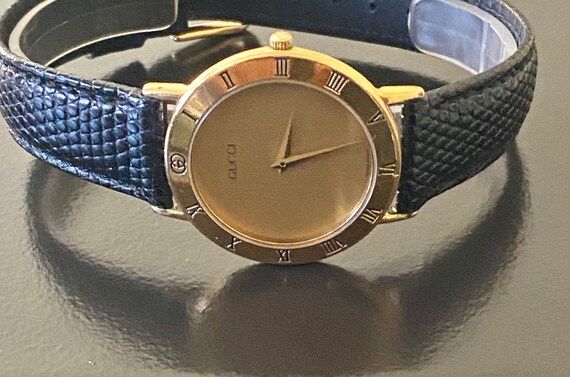 Gucci men's 8" gold watch 100% authentic new battery new blk strap 219.99 | Etsy (US)