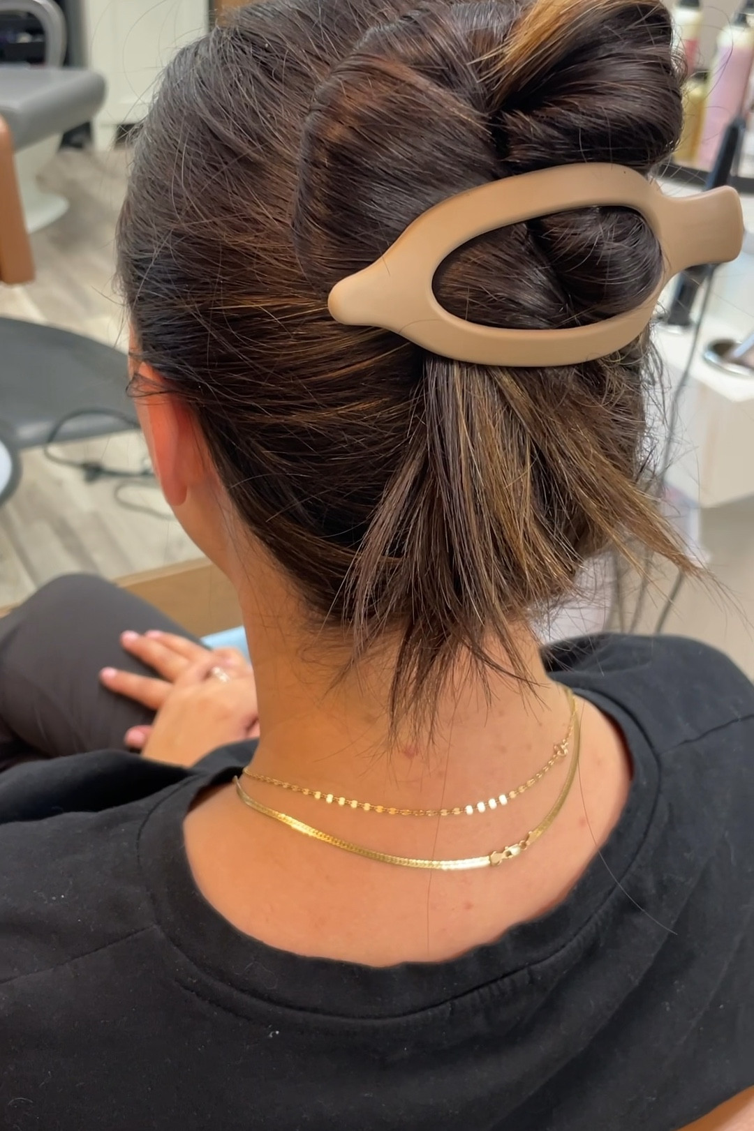 Simplicity

This helps keep your hair up but doesn't pull or cause lots of tension. You can lean your head back and not get stabbed by the clip and still look professional.

Hair win!

