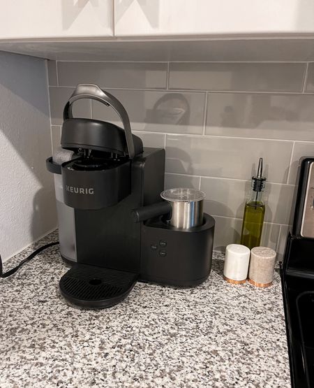 What is on my kitchen counter - my Keurig with latte maker steamer (use this baby everyday), marble salt and pepper shakers, olive oil glass dispenser bottle 

#LTKhome #LTKfamily #LTKsalealert