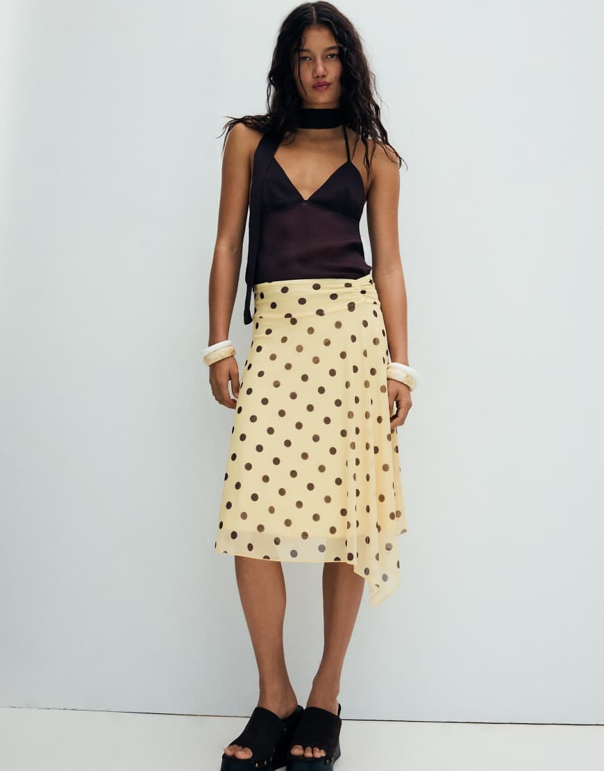 Bershka Asymmetric polka dot midi skirt in yellow | ASOS (Global)