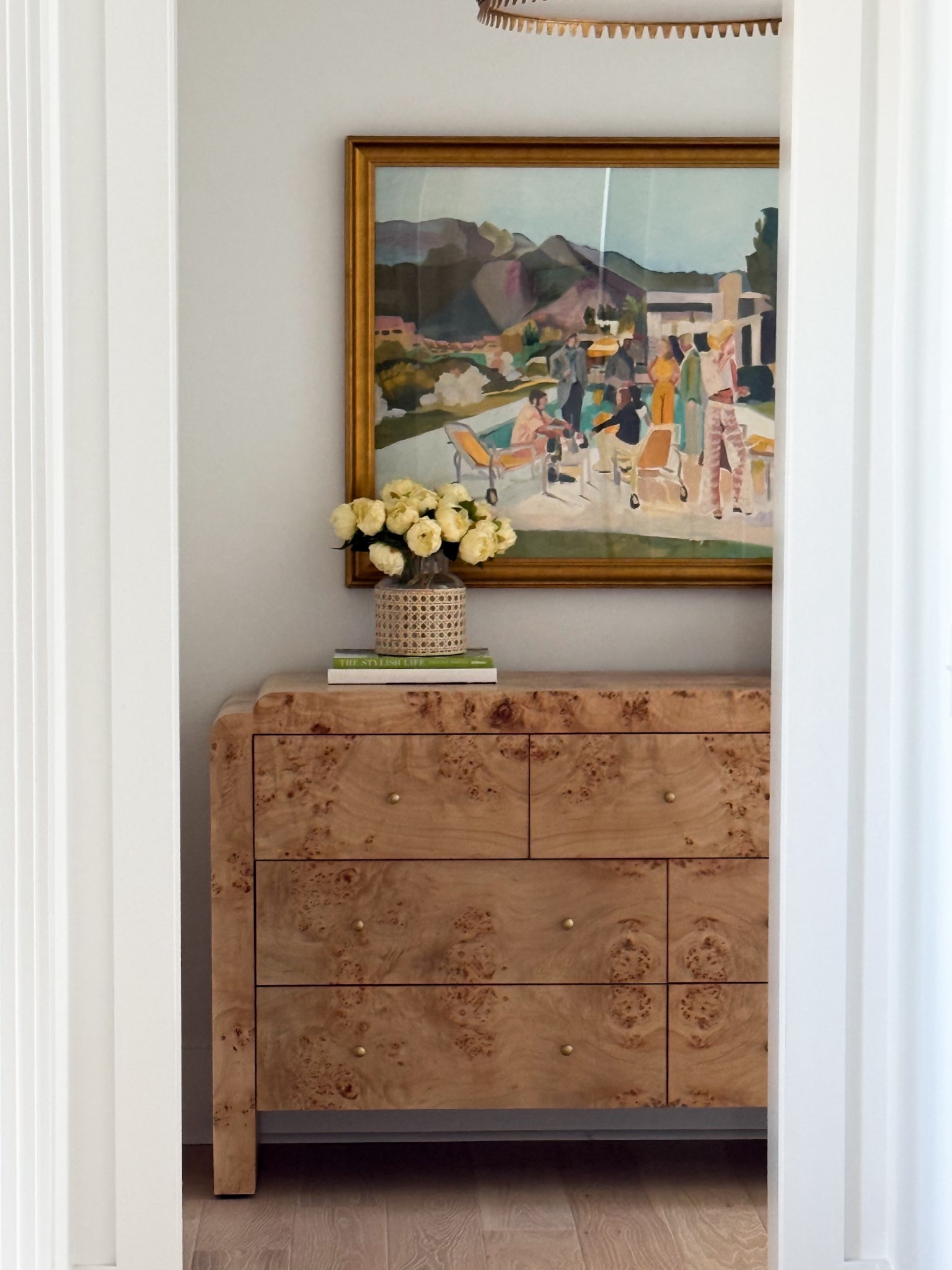Hallway styling moment 🤍 Creating a warm, organic modern entryway with this stunning burl wood dresser from Anthropologie (and they have free shipping right now 🙌). Styled with landscape artwork by Urban Garden Prints and a custom gold frame from Framebridge for a layered, designer look. Love this neutral hallway decor, entryway styling idea, and modern organic home aesthetic.

#LTKhome #LTKstyletip #hallwaydecor #entrywaydecor #burlwood #anthropologiehome #neutralhome #organicmodern #entrywayinspo #homedecorfinds