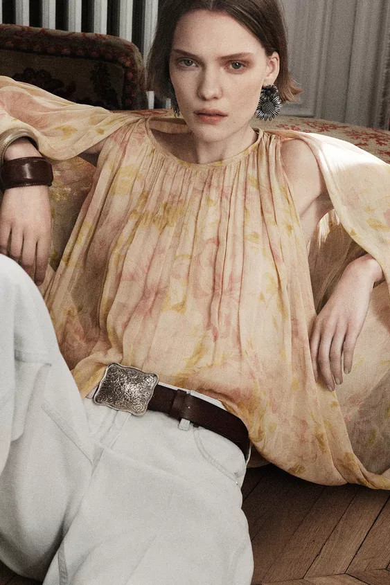 ZARA WOMAN COLLECTIONRound neck shirt with long puffed sleeves with elastic cuffs. Asymmetric hem... | Zara US