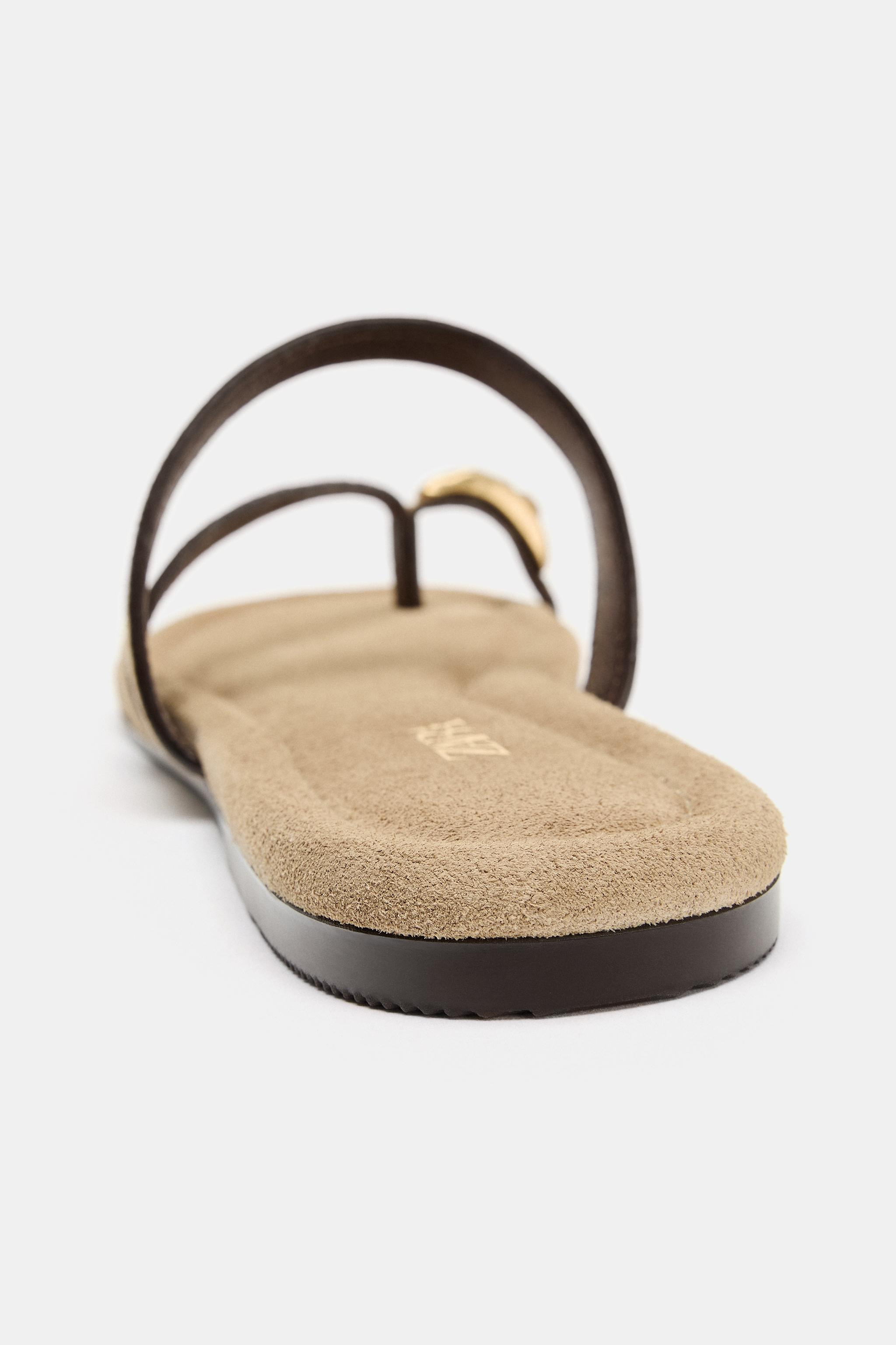 Flat split suede sandals. Front strap with toe divider and metal appliqu\u00e9 detail. Instep str... | Zara UK