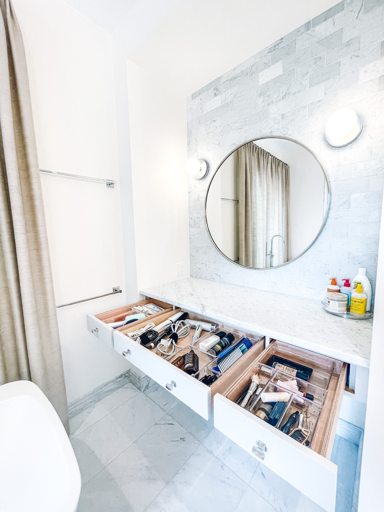 Bathroom organization. IDesign Linus Shallow Drawer Organizers from The Container Store. Layne Round wall mirror from Pottery Barn✨

#LTKhome #LTKfamily