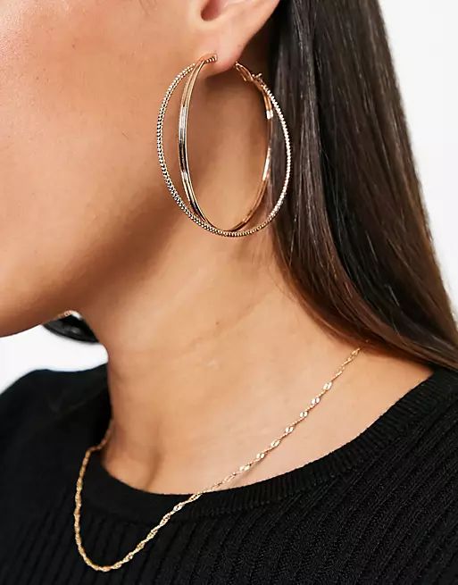 ASOS DESIGN hoop earrings in large cross over design in gold tone | ASOS (Global)