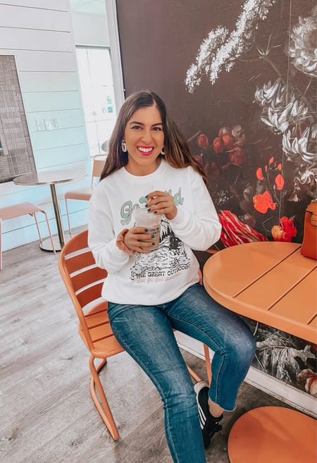 Cutest Sweatshirt 🩵 It says Go Wild - The Great Outdoors!! Super soft and wore it several times for vacation on the zip line to hours in the plane. Wearing size Small for oversized fit. 

Travel Outfit | Comfy Outfit 


#LTKTravel #LTKSaleAlert #LTKFindsUnder50