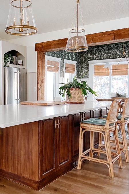 English cottage farmhouse dining room wallpaper, bamboo shades, gold cone pendants, wicker barstools 

#LTKhome