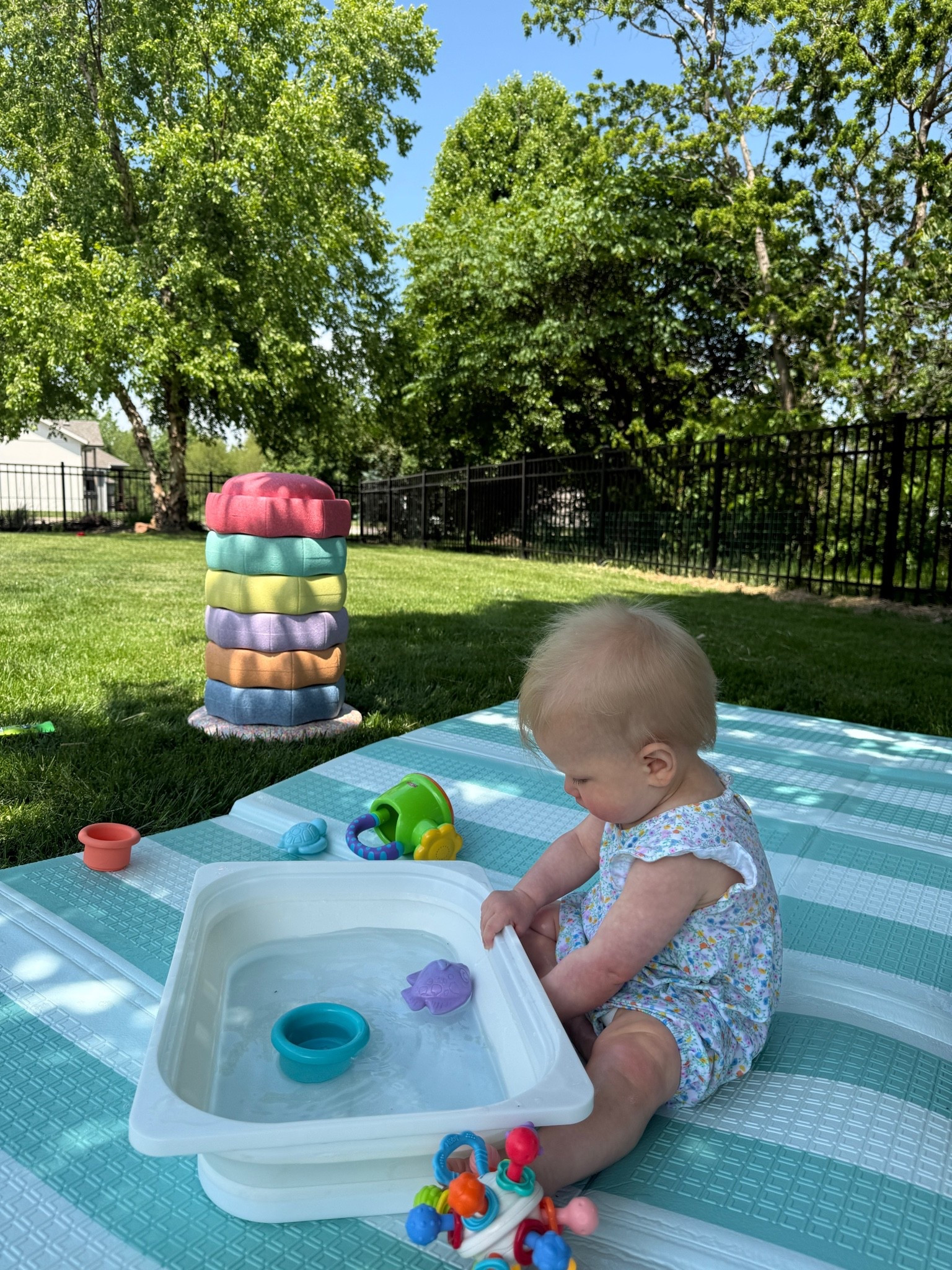 Kids play // toddler outdoor fun // kids games // water activity // stacking cups // Nuby mat // outside play // Nuby stepping stones