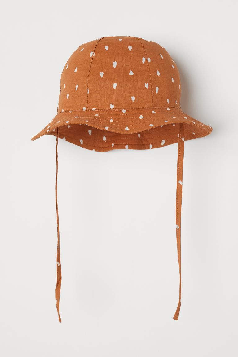 Sun hat in airy, woven cotton fabric. Wavy brim and ties underneath. Lined. | H&M (US)