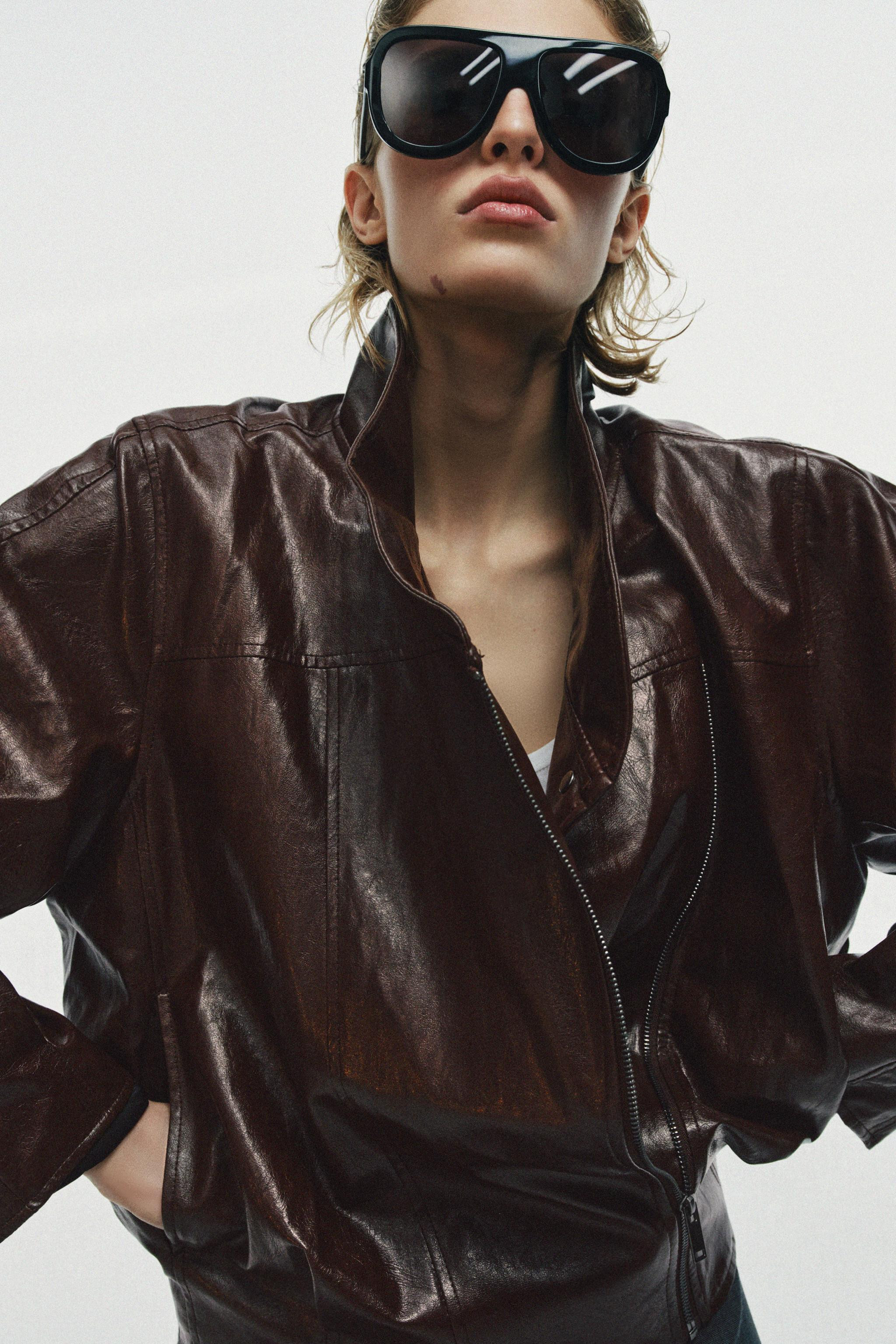 ZARA WOMAN COLLECTIONFaux leather jacket with a high collar and long cuffed sleeves. Front hidden... | Zara US