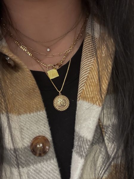 My everyday necklace stack has 4 standing necklaces (almost all gifted to me so I can’t find the exact ones!): a 2 chain choker with a clear stone, a faceted paper clip chain, a padlock necklace, + a Chanel necklace from Love Of Gold Vintage (which isn’t a LTK partner so I added something similar). I absolutely love gold jewelry + even though I have a ton - these are my go-to pieces for everyday wear! | accessories, gorjana, boutique, gold plated, basic, designer

#LTKunder100 #LTKcurves