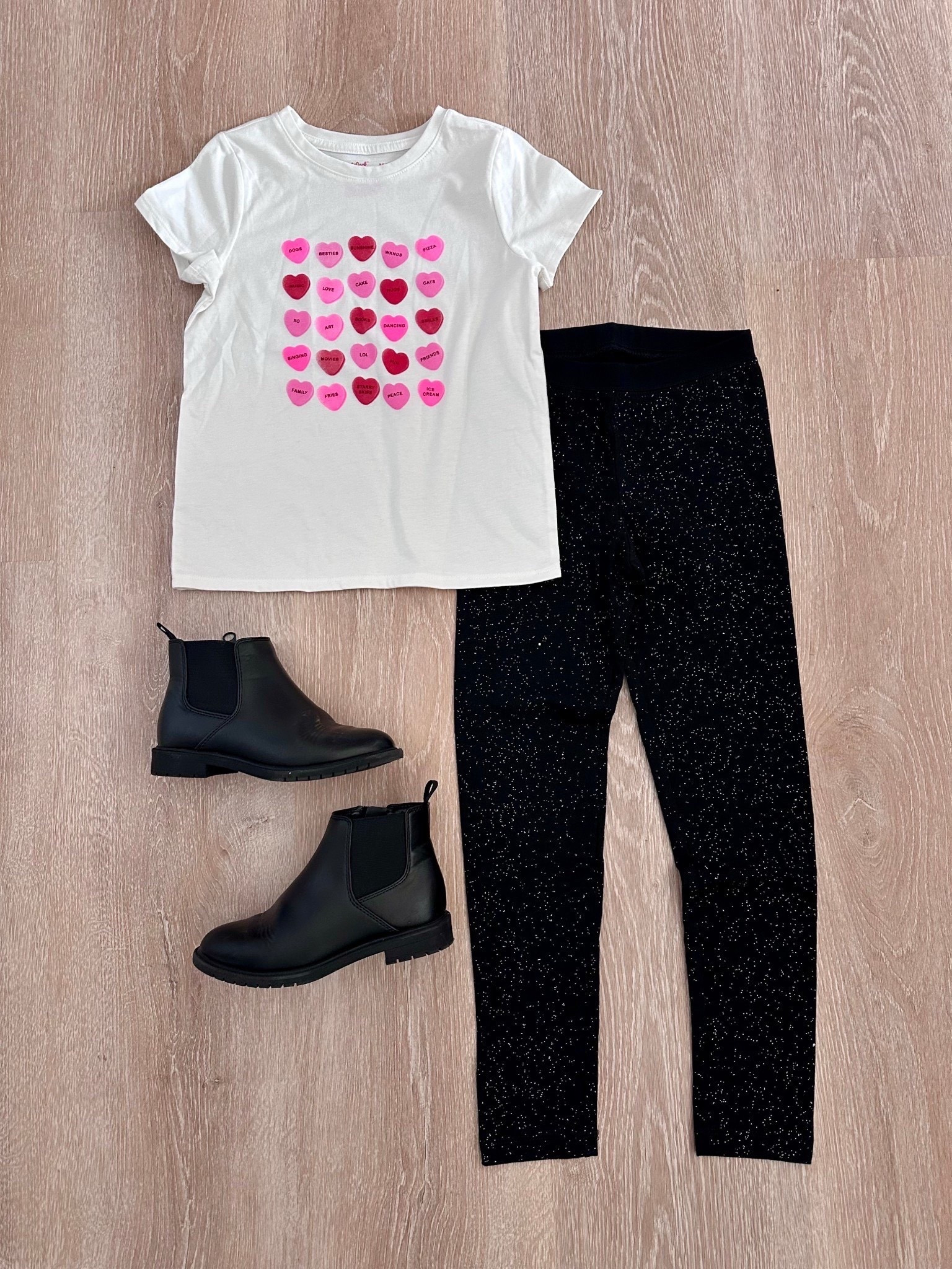 This outfit is too cute for Valentine’s Day! 💖 The Girls’ Candy Hearts Graphic Tee, black sparkle leggings, and kids’ black Chelsea ankle boots make the sweetest (and comfiest) outfit for little girls. Perfect for school, playdates, or Valentine’s parties. Linking all the pieces!
girls Valentine’s Day outfit, kids Valentine outfit ideas, candy hearts shirt, sparkle leggings for girls, kids Chelsea boots, toddler girl Valentine outfit, little girl fashion, cute kids outfits

#LTKKids #KidsFashion #ValentinesDayOutfit #GirlsOutfits #ToddlerStyle #LittleGirlStyle #ValentinesDayKids #CuteKidsClothes #KidsOOTD #HolidayOutfits #MomLife #LTKStyle

#LTKKids #LTKmomlife #LTKSeasonal