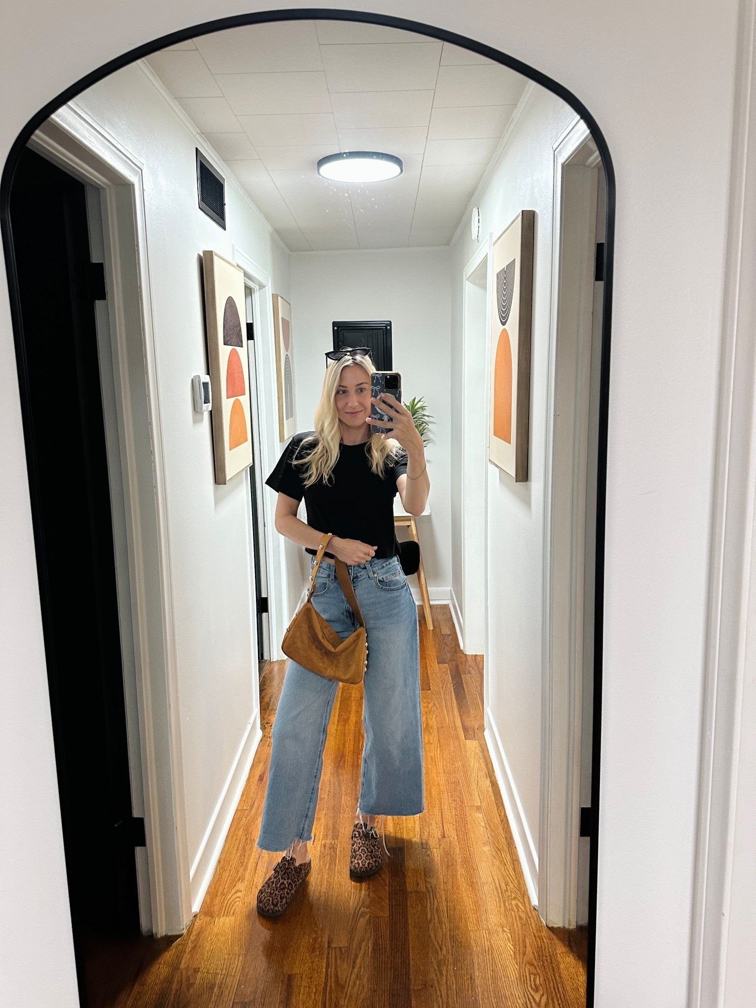 Obsessed with my leopard clogs! I got my normal size 🐆 This purse is pretty with it. It is perfect for fall and winter. It has silver accents! I also linked my basic black tee. Hope you’re having a great November. #fallpurse #leopardshoes 

#LTKFindsUnder50 #LTKShoeCrush #LTKItBag