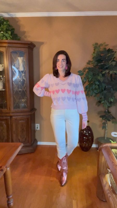 Heart sweater (size small). Cream with leather details high rise straight jeans (size 27). Pink metallic boots (size 8.5). #heartsweater #sweater #sweaters #jeans #denim #creamjeans #leatherjeans #highrisejeans #highrisedenim #boots #metallicboots #pinkboots #valentinesdayoutfit 
Valentine’s Day Outfit 

#LTKstyletip #LTKfindsunder100 #LTKSeasonal