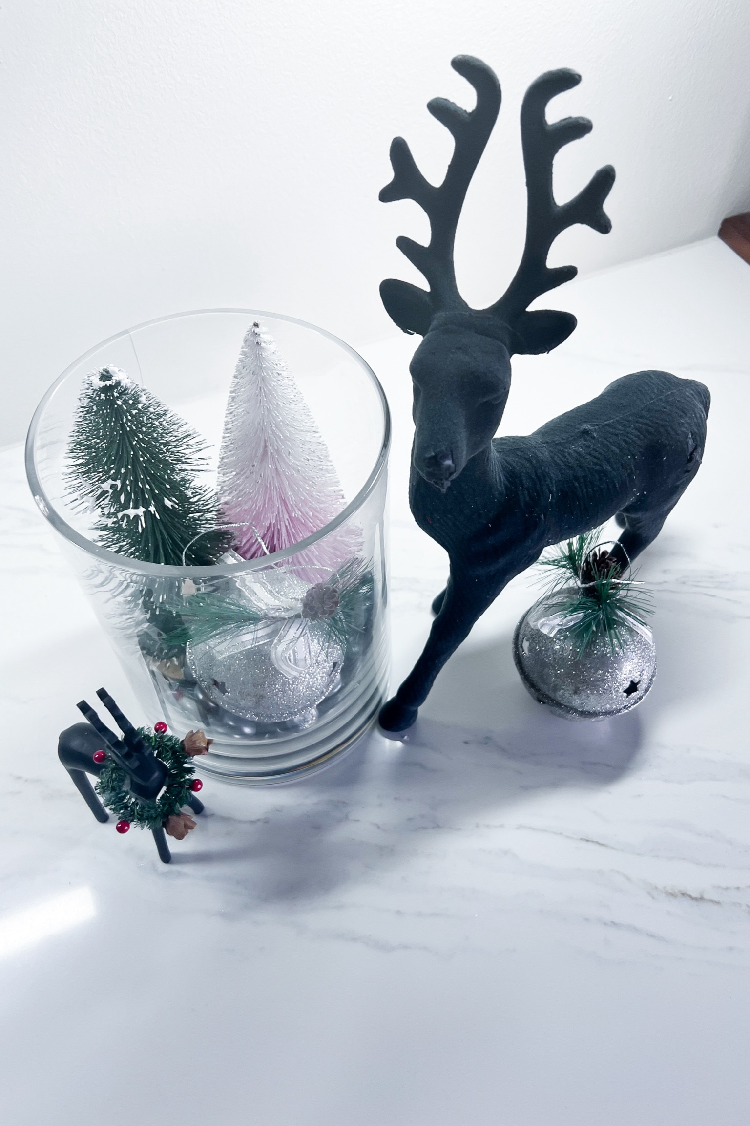 Reindeer decor and tablescape decor details 
Christmas
Reindeer
Glass containers
Trees
Christmas trees
Ornaments
Rocks
Table
Dinner
Holiday dinner
Decor

#LTKSeasonal #LTKHoliday #LTKHome