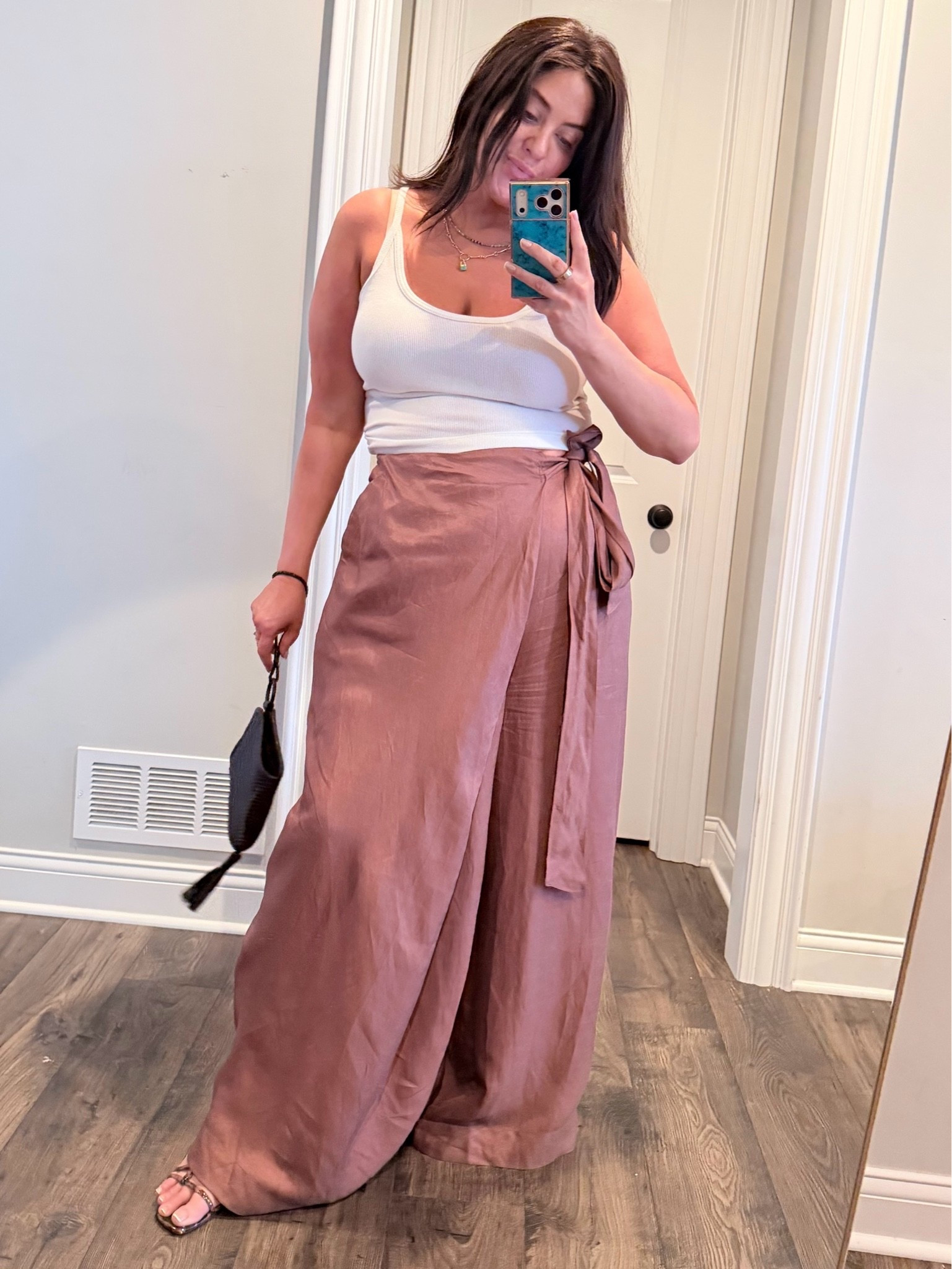 These wrap pants keep selling out. I love this color and the material is very soft. They run VERY big. Size down 1-2 sizes, at least.