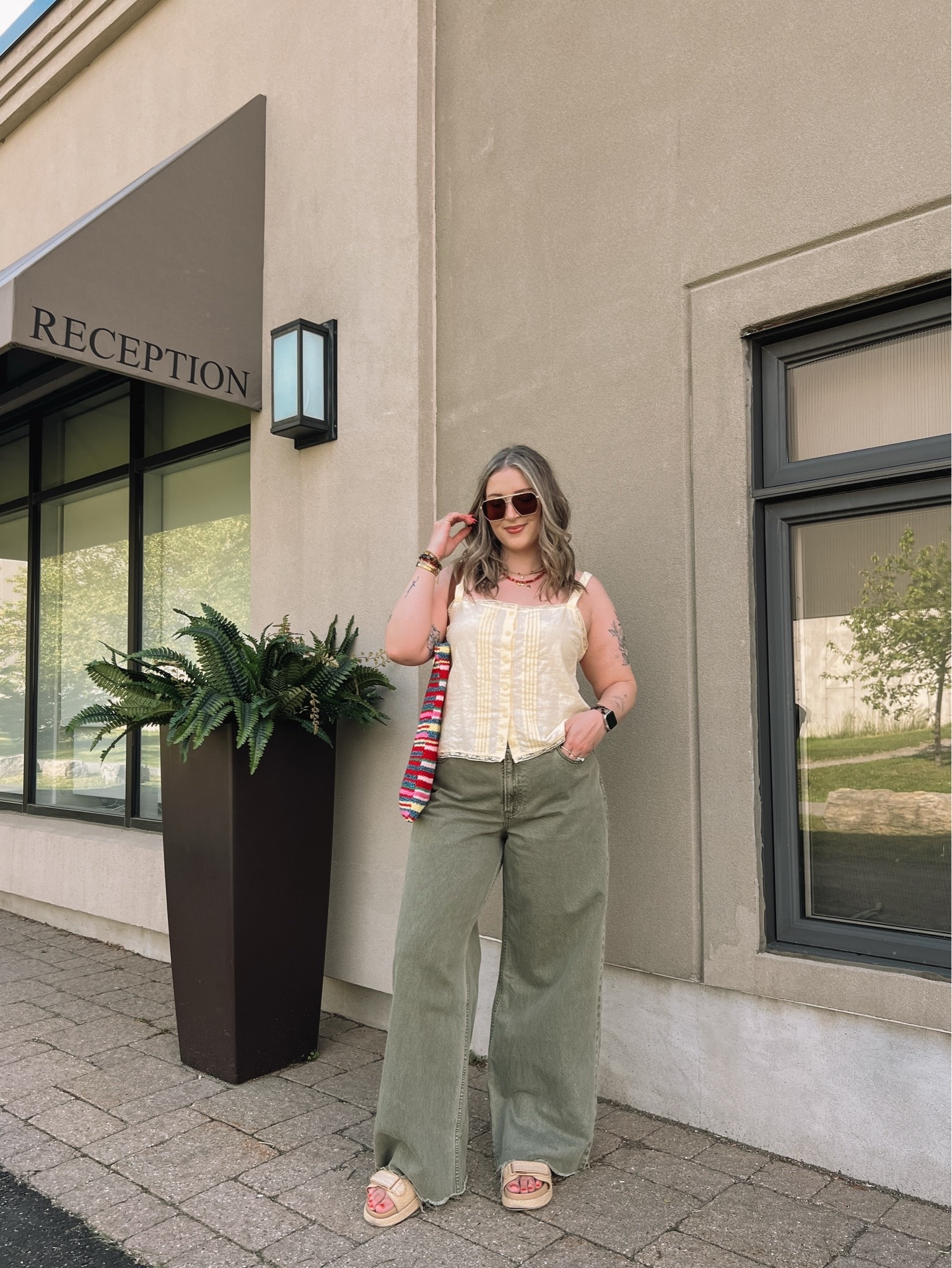 Colorful summer outfit! Wearing my usual L in the butter yellow tank top. Wearing 32 long (should have done 31) in the jeans. Also cut the hem for a custom length! Canadian top & bag links under “similar products”. Linked similar platform sandals

#LTKsummer #LTKmidsize #LTKjeans
