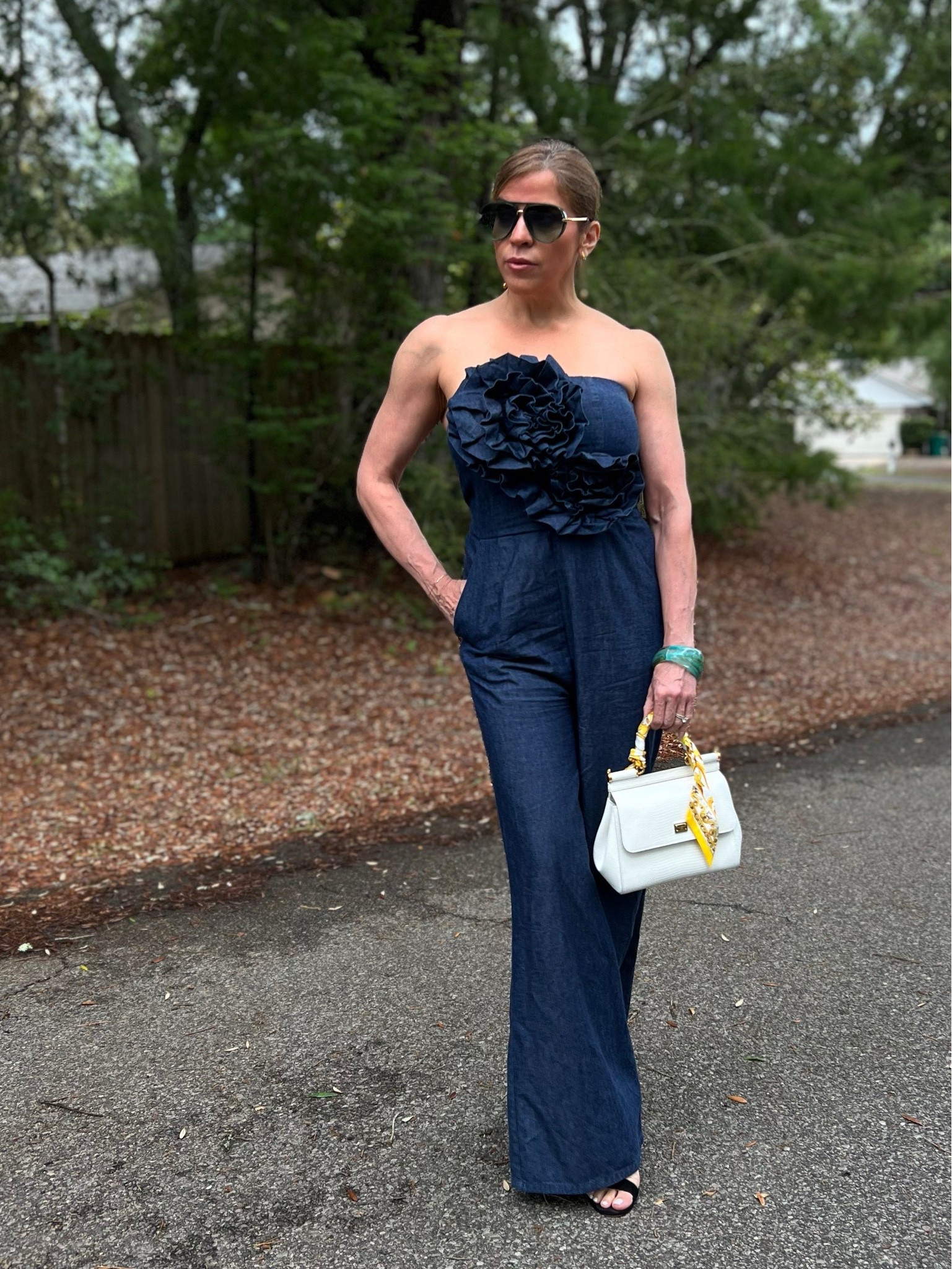 One piece. Zero effort. All impact. 💙 A strapless denim jumpsuit with a dramatic floral corsage — because why blend in? Styled with a handle bag and a jade cuff for that final chef’s kiss. Link in bio to make it yours. ✨

#LTKdayinmylife #LTKootd #LTKmomlife